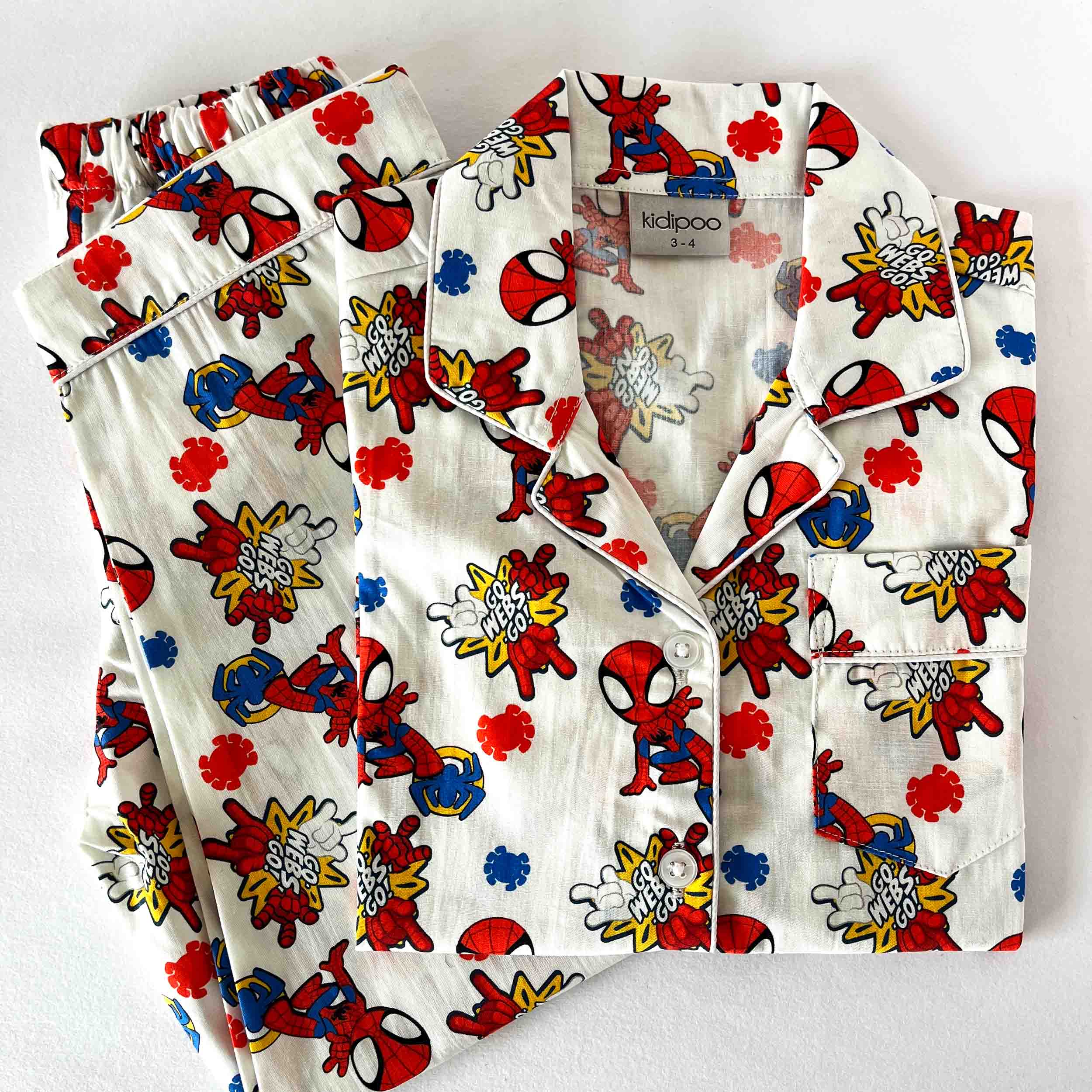 Children's pajama set with Spider-Man pattern on a white background