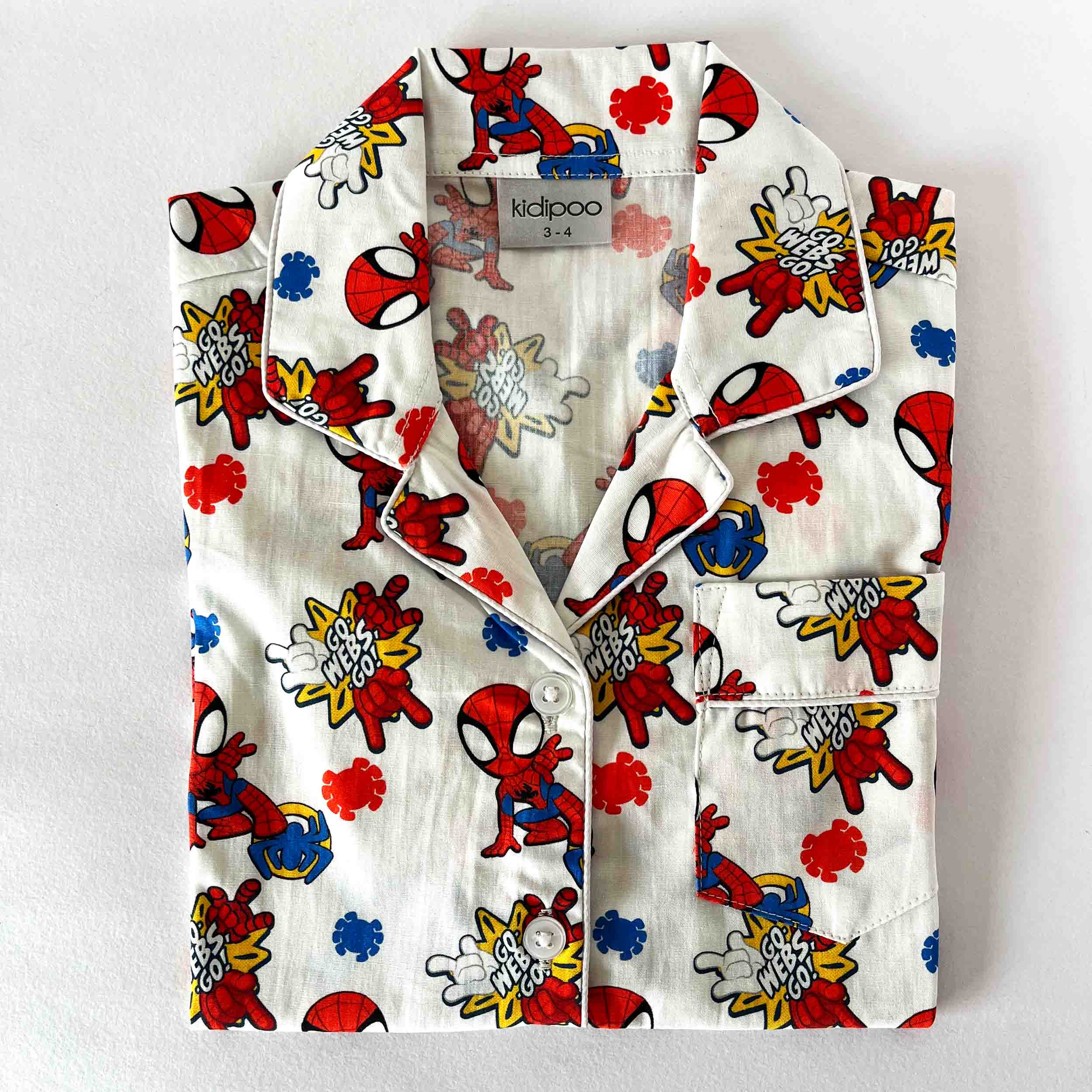 Children's shirt with colorful cartoon character print on a white background