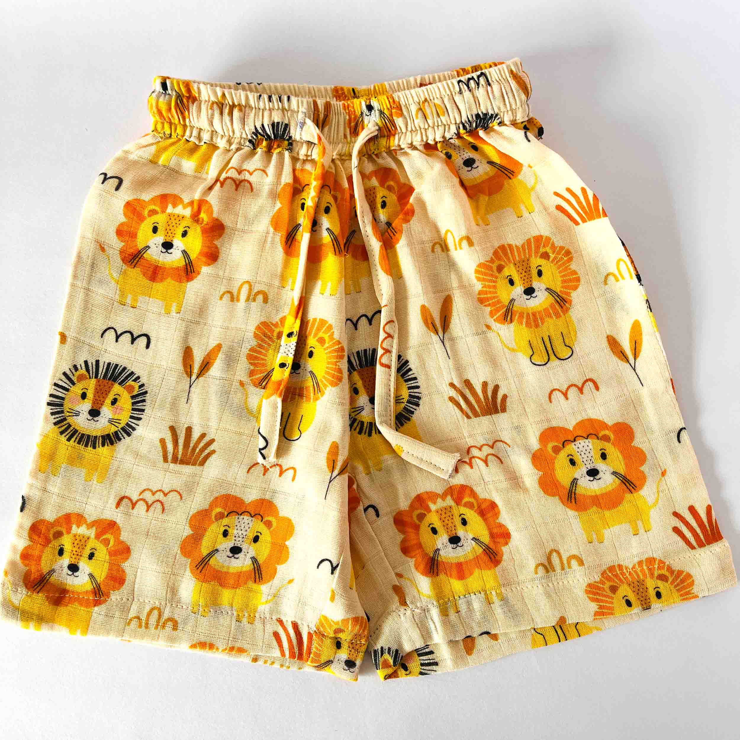 Kids orange muslin cotton shorts with lion print elastic waist summer wear