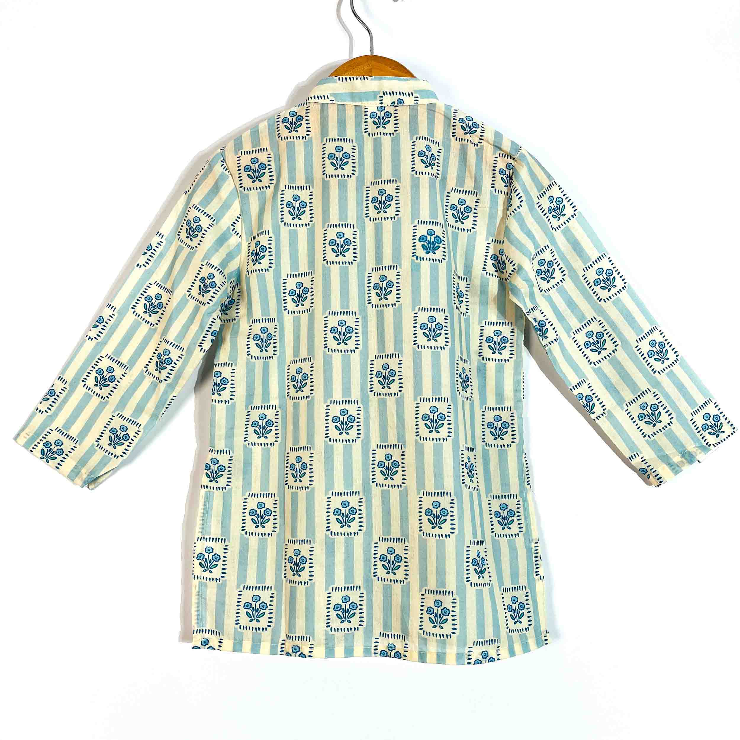 Back view of kids blue printed cotton kurta featuring an all-over traditional print