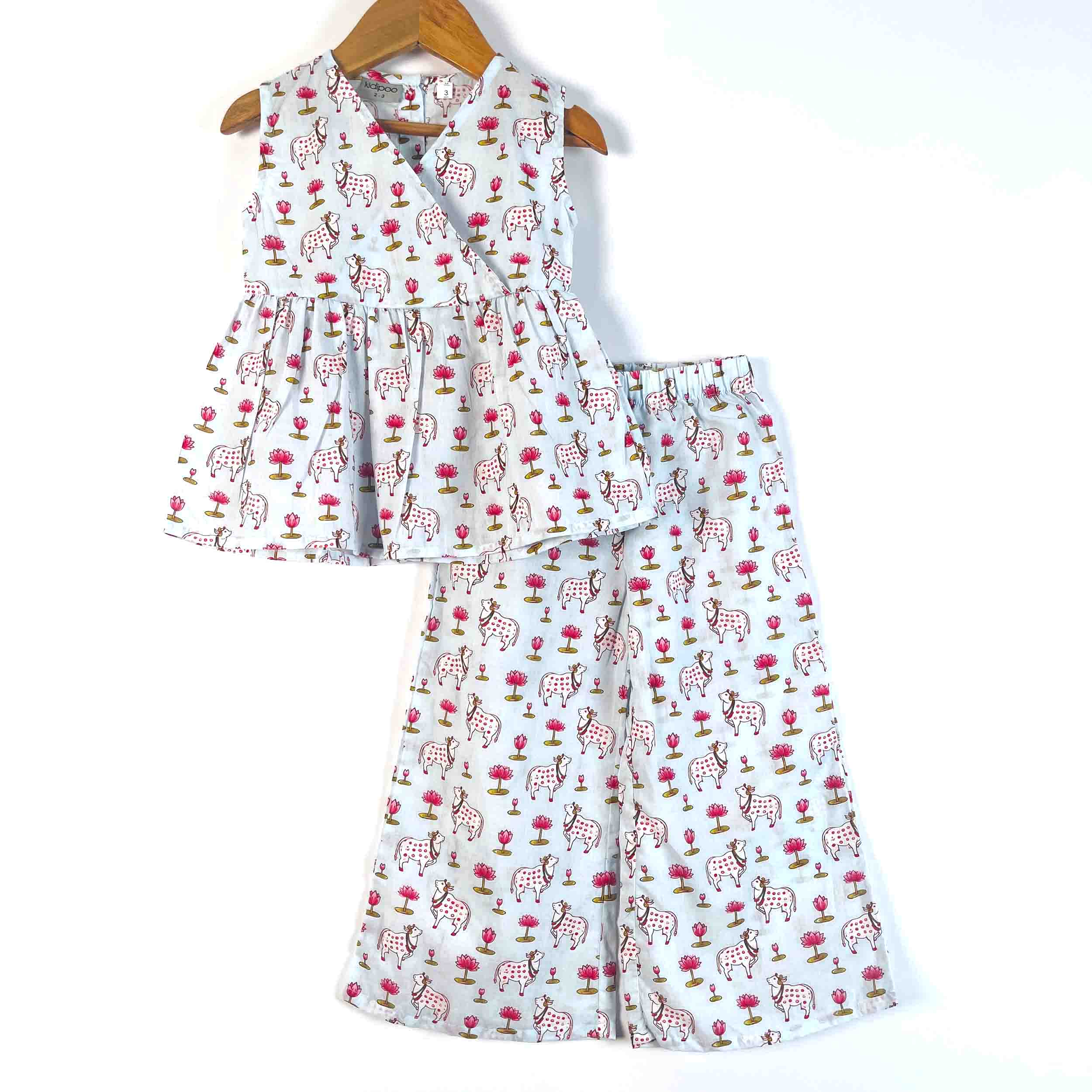 Kids Blue Pichwai cotton co-ord set with a sleeveless V-neck flared top and matching wide-leg pajama featuring an all-over cow and floral print