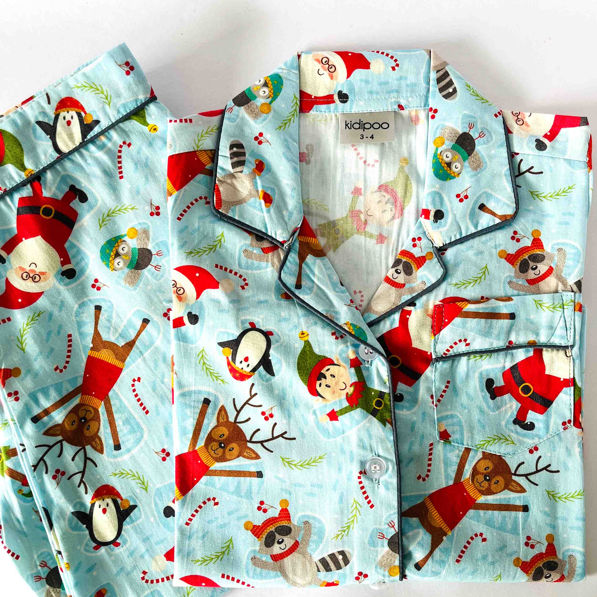 Blue Santa print kids night suit soft cotton sleepwear set folded view