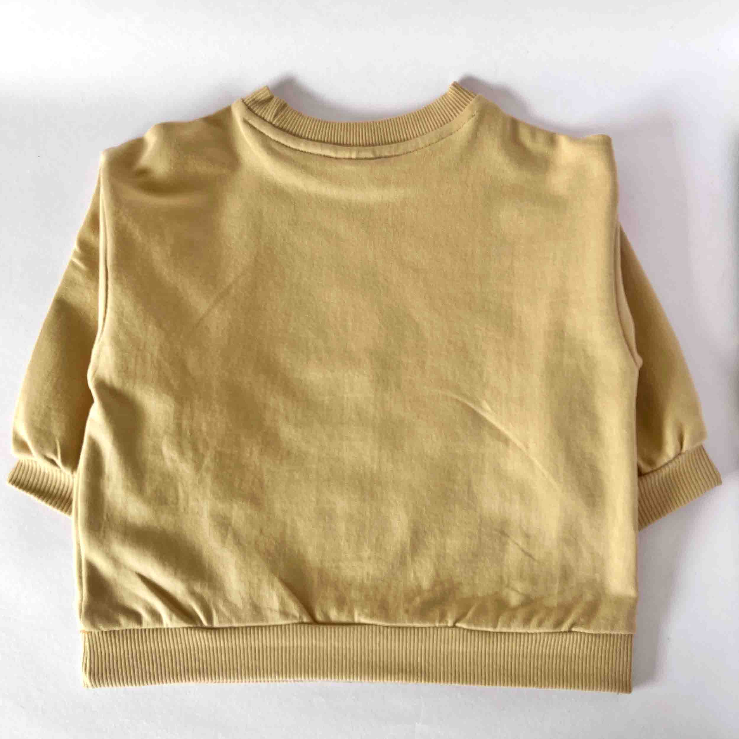 Beige sweatshirt on a white background