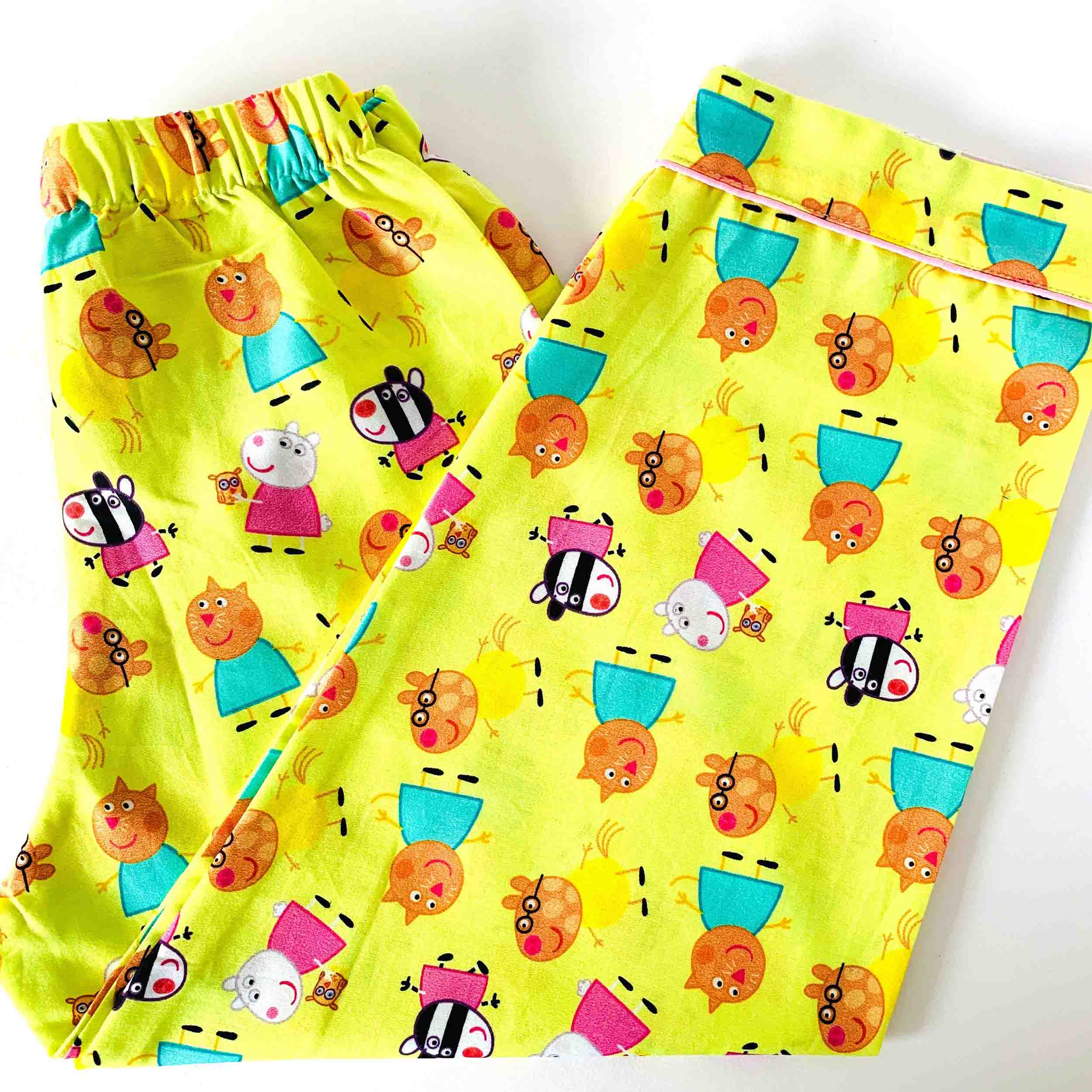 Yellow shorts with cartoon character pattern on a white background