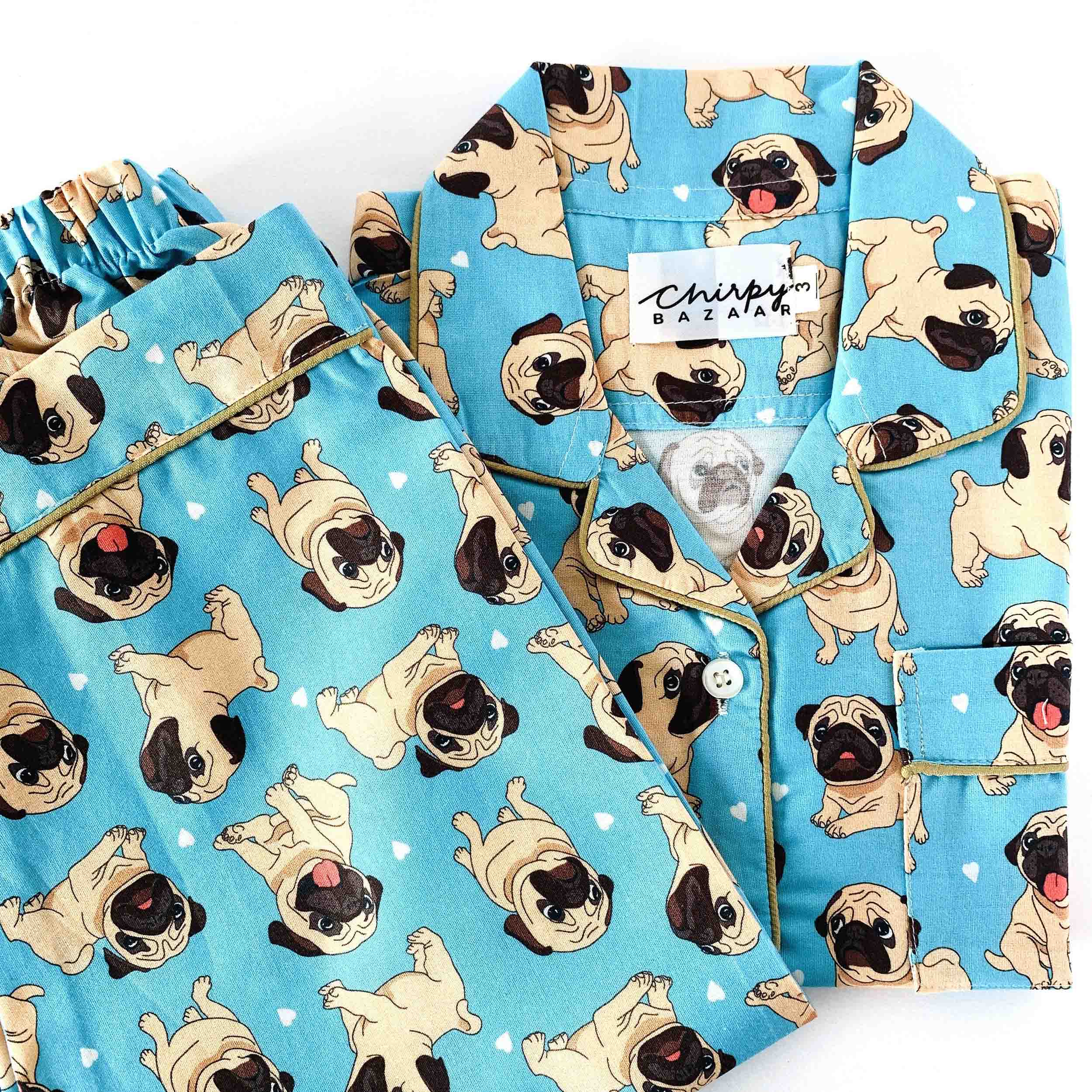 Blue pajama set with pug dog pattern on a white background