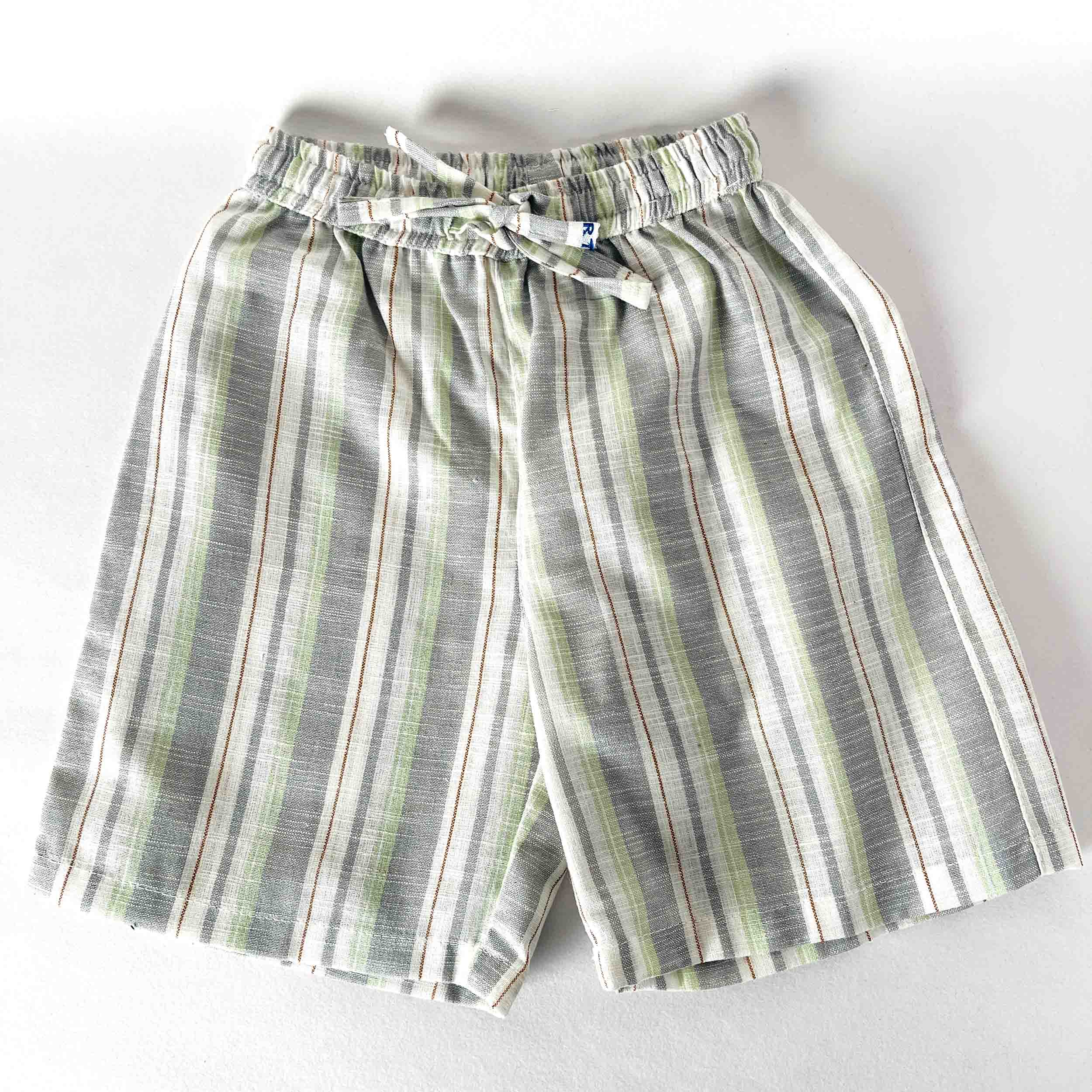 Kids striped shorts in grey and green tones with an elastic waistband and drawstring, displayed on a white background