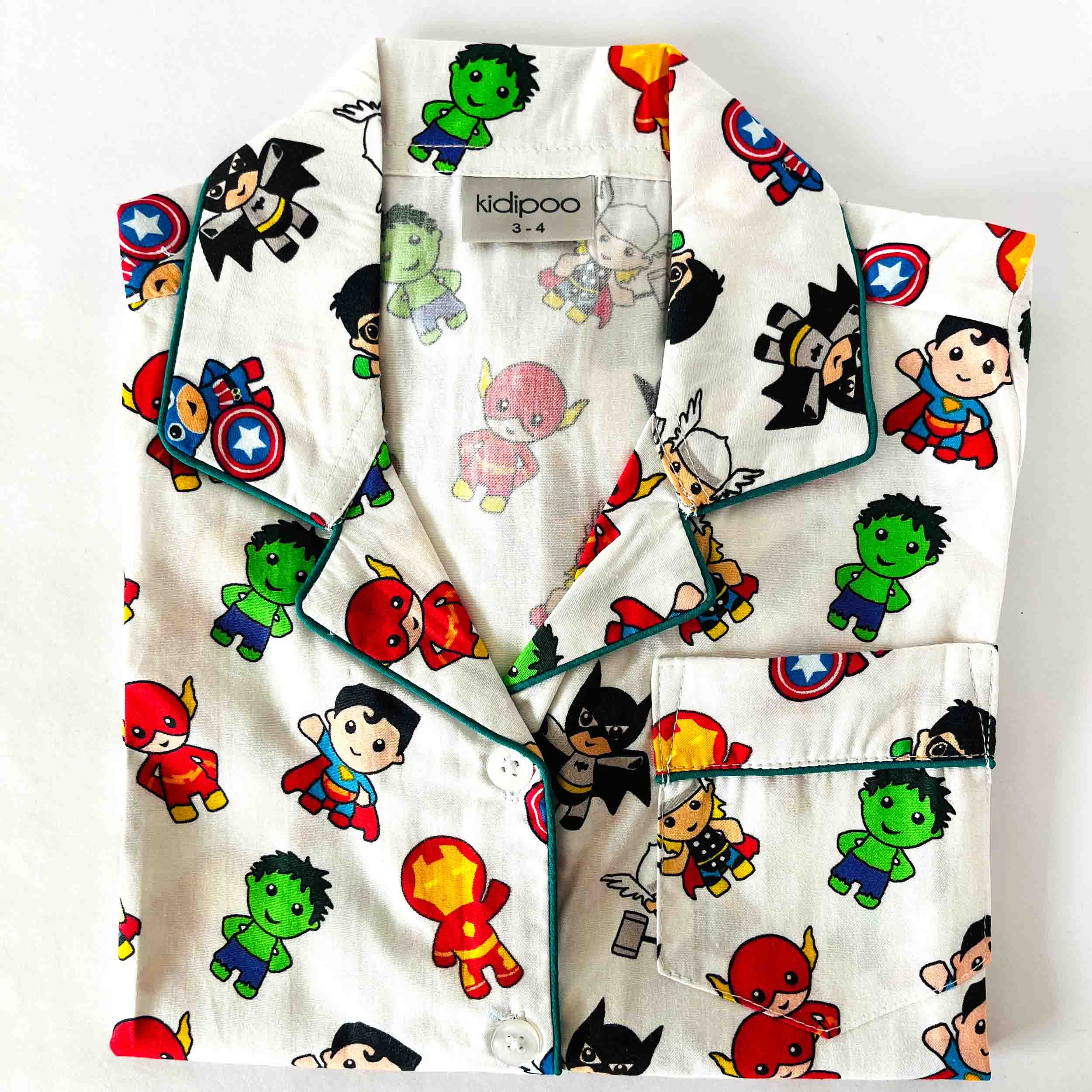 Children's superhero-themed pajama set with cartoon characters on a white background