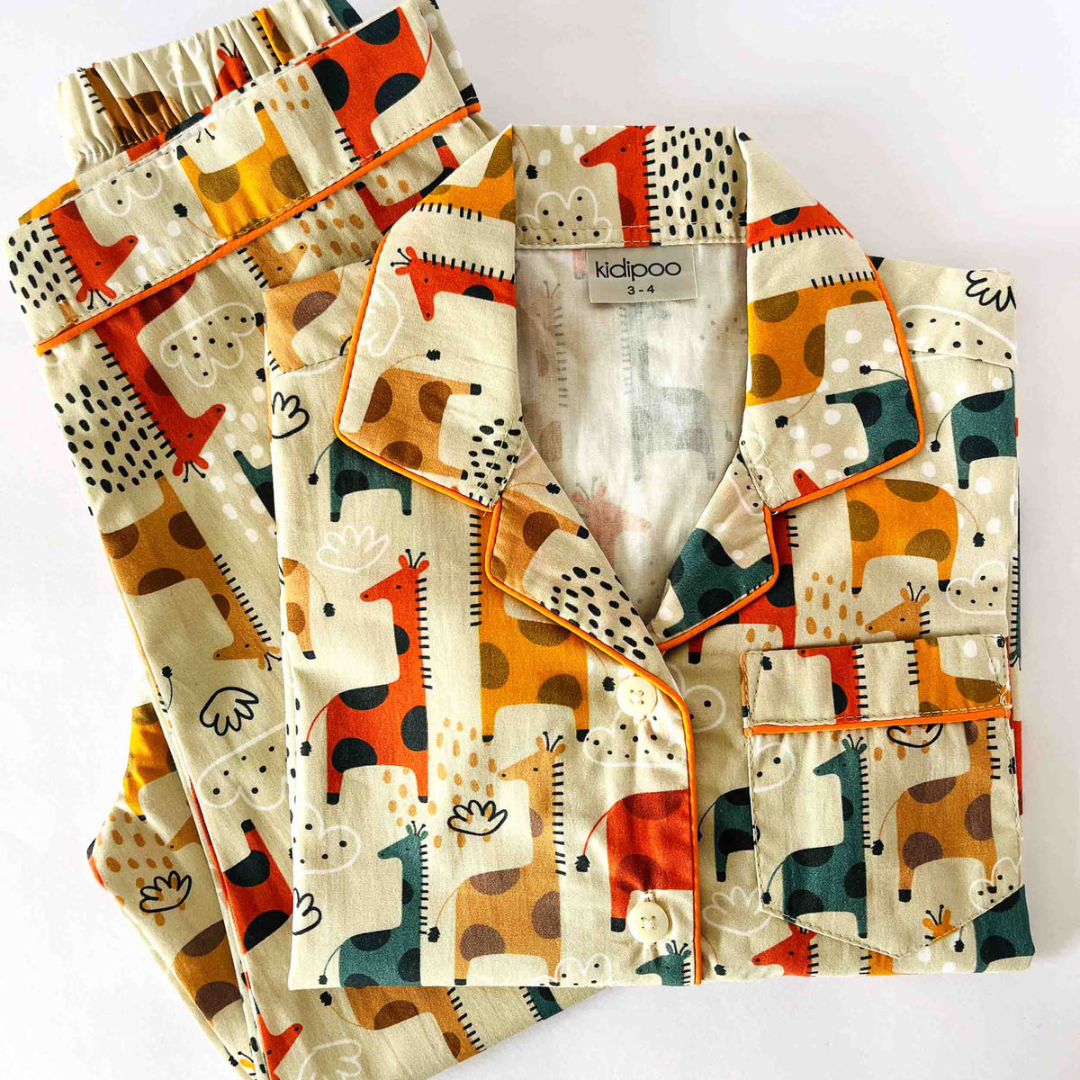 Children's pajama set with animal pattern on a white background