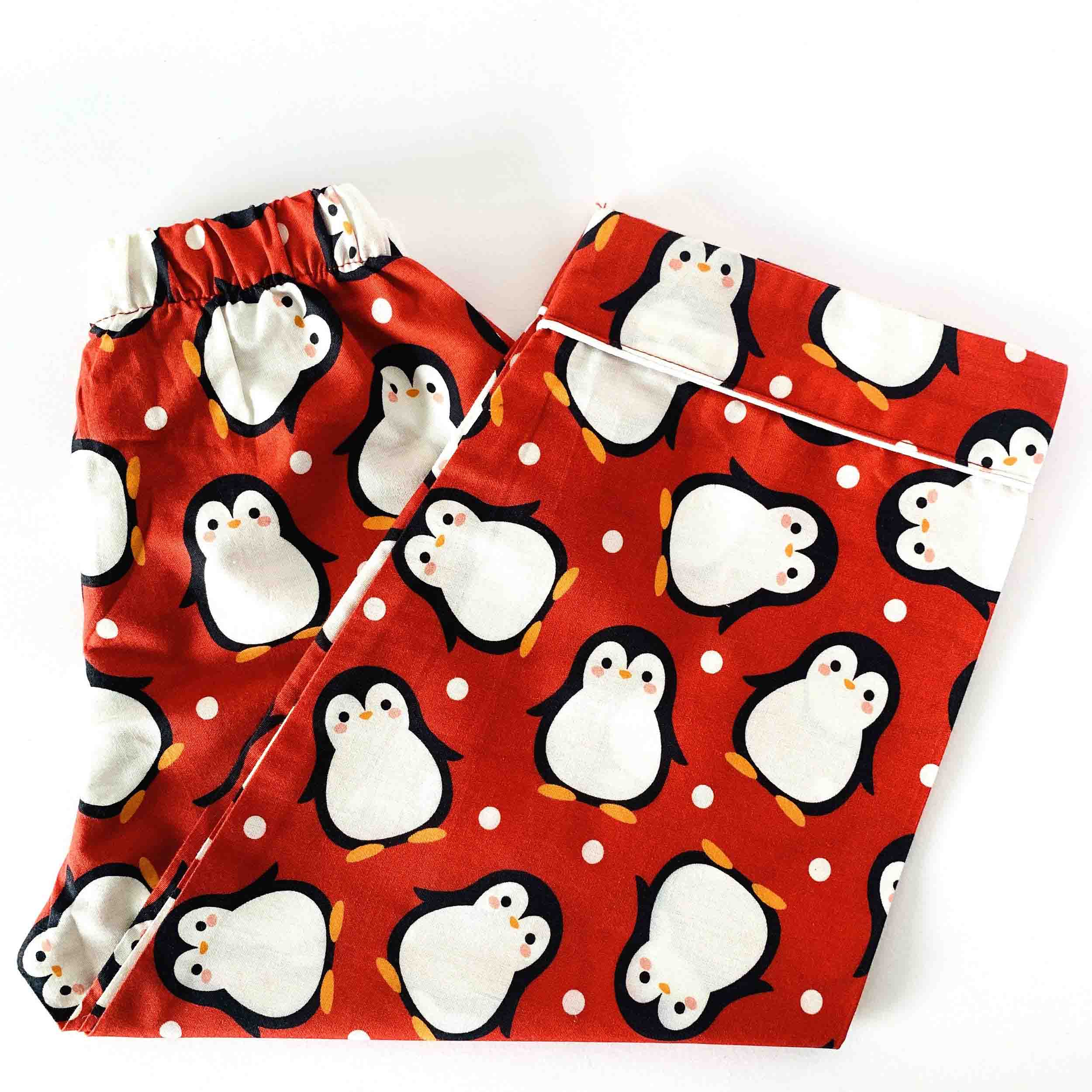 Kids red penguin print cotton pajama pants with elastic waistband soft breathable sleepwear bottom for boys and girls