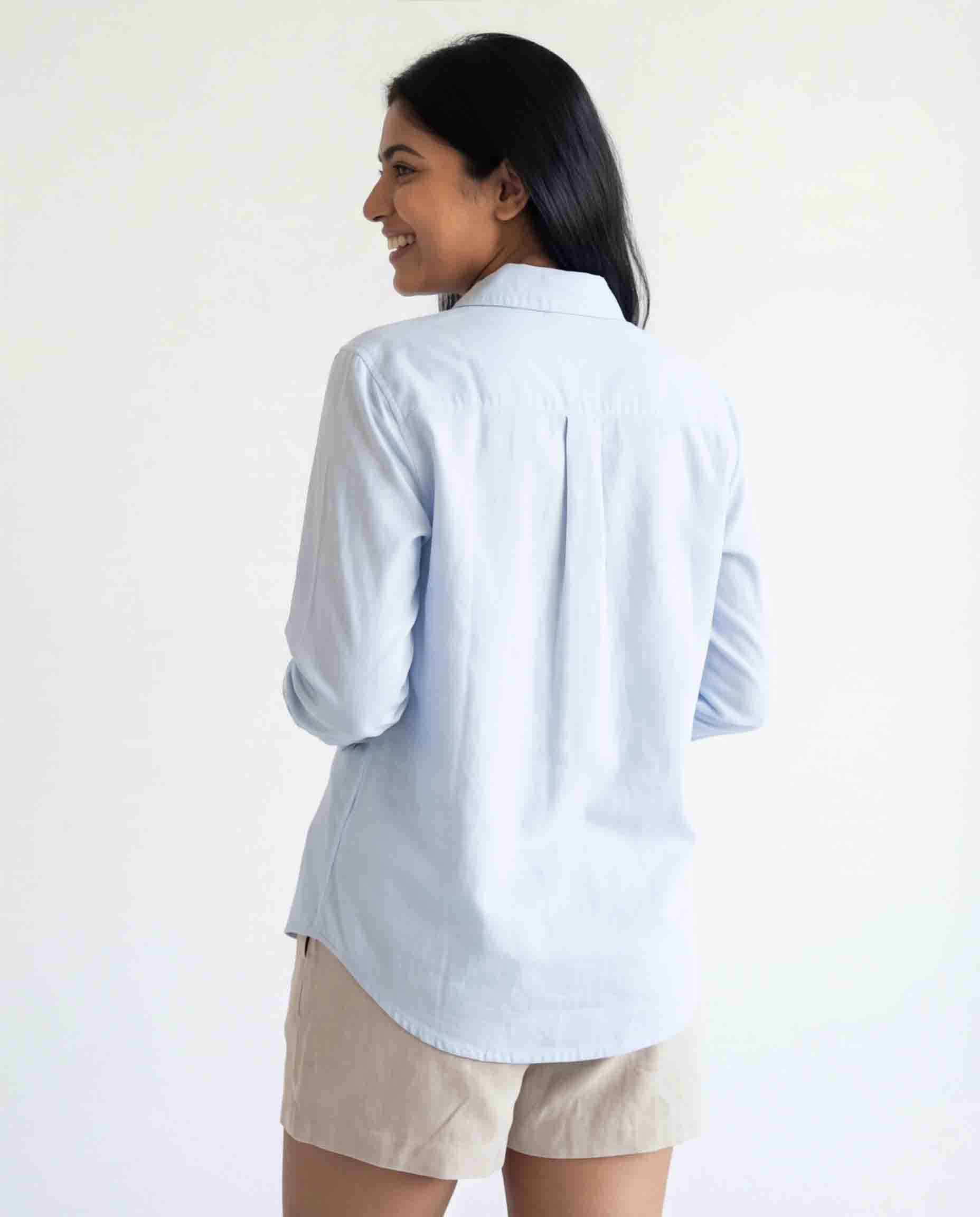 Back view of women's sky blue cotton linen shirt long sleeves casual wear