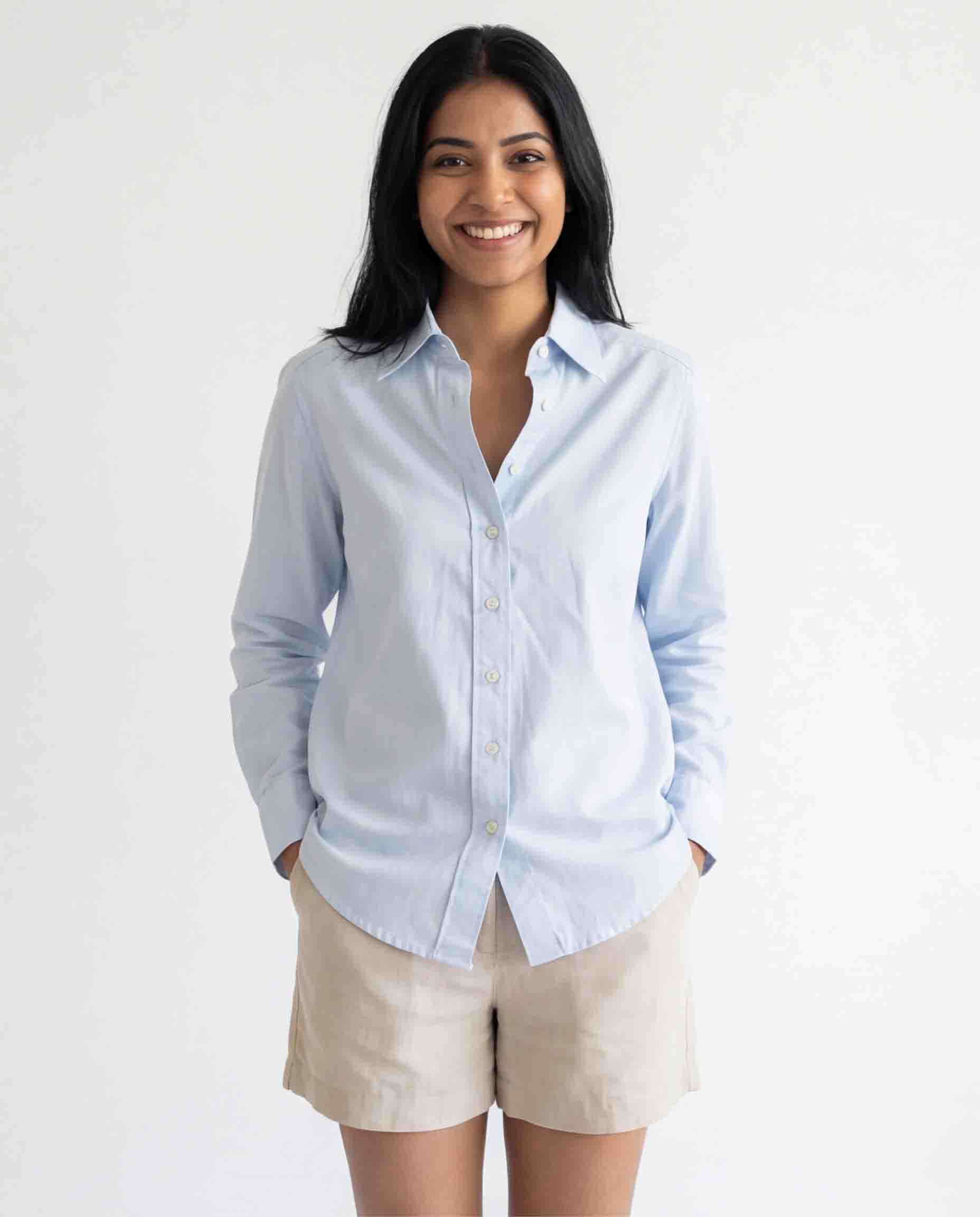 Woman wearing sky blue cotton linen shirt front view casual office wear