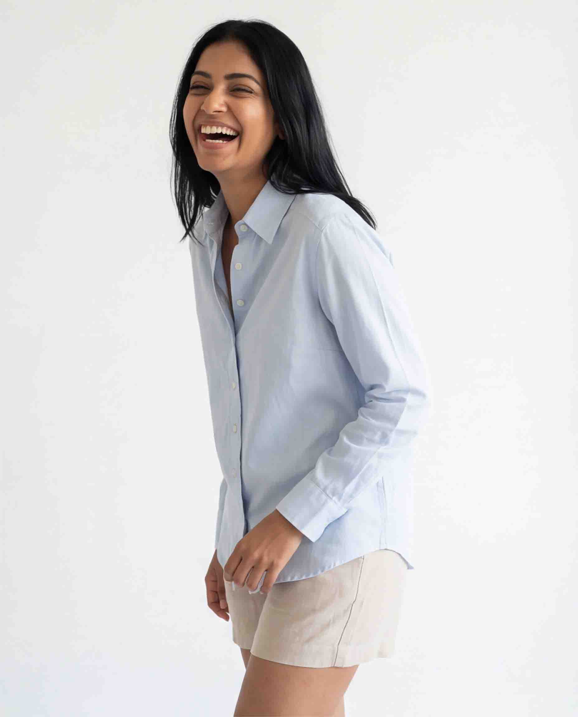 Sky blue cotton linen women's shirt fabric and button detail close-up