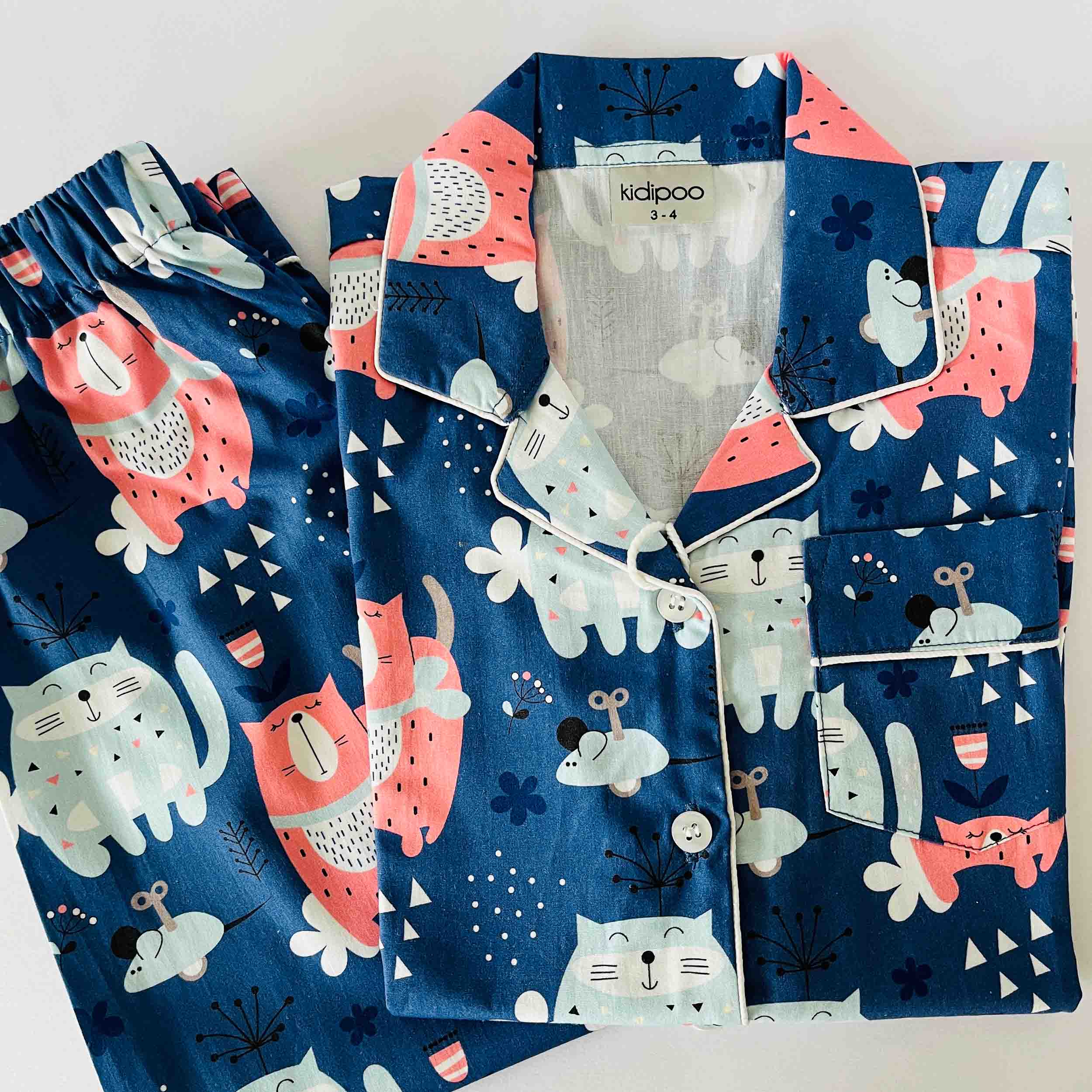 Children's pajama set with animal pattern on a white background