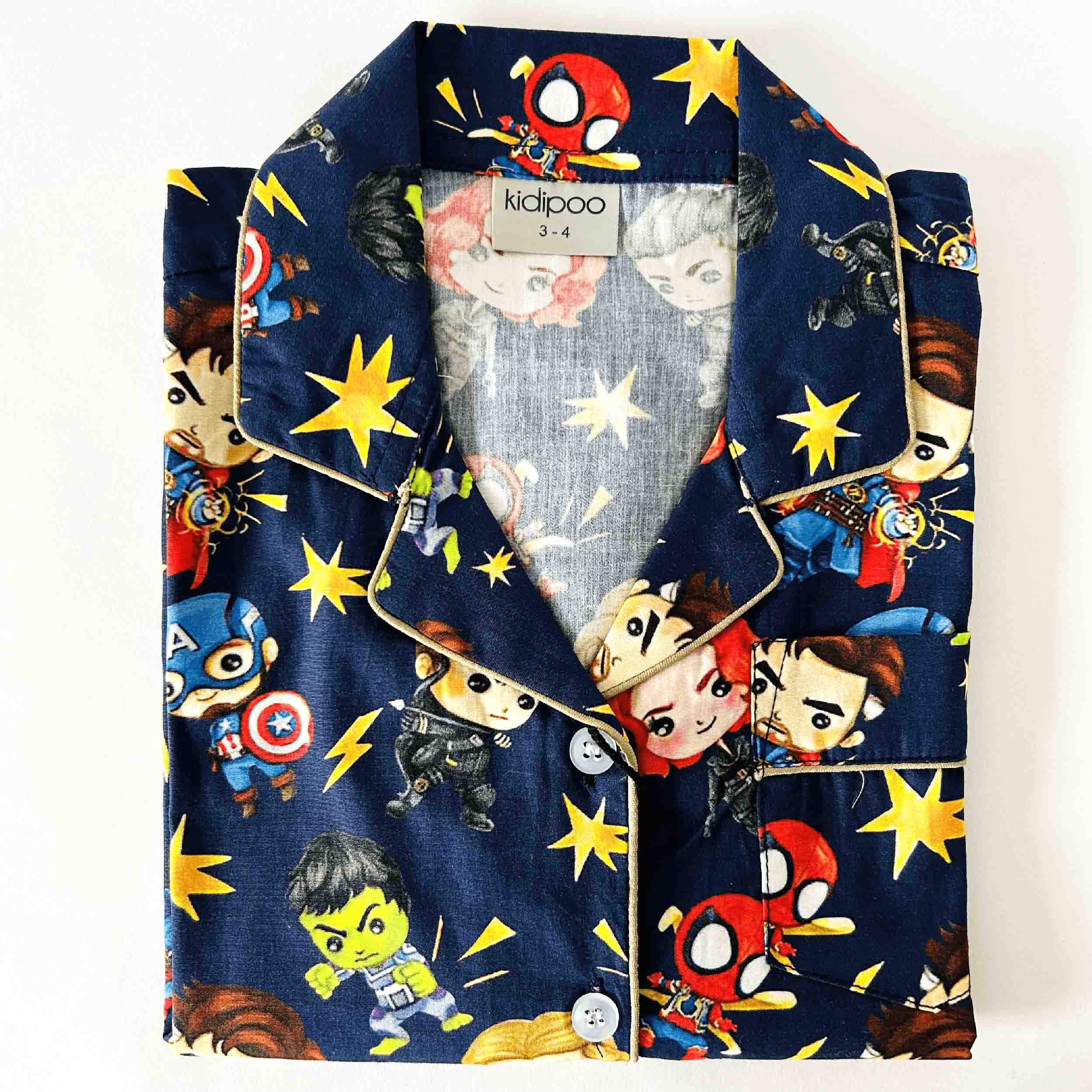 Children's pajama set with superhero design on a white background