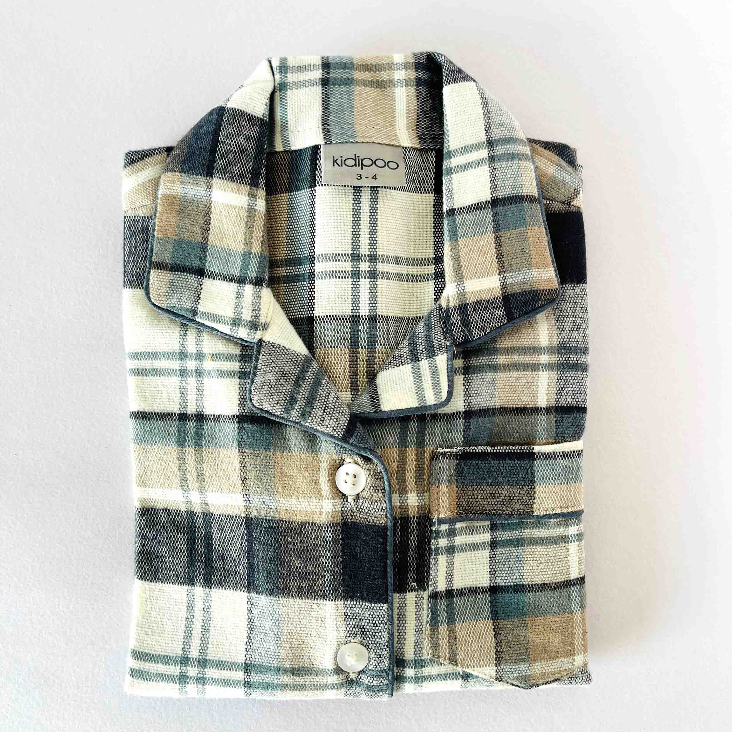 Plaid children's jacket with buttons on a light gray background