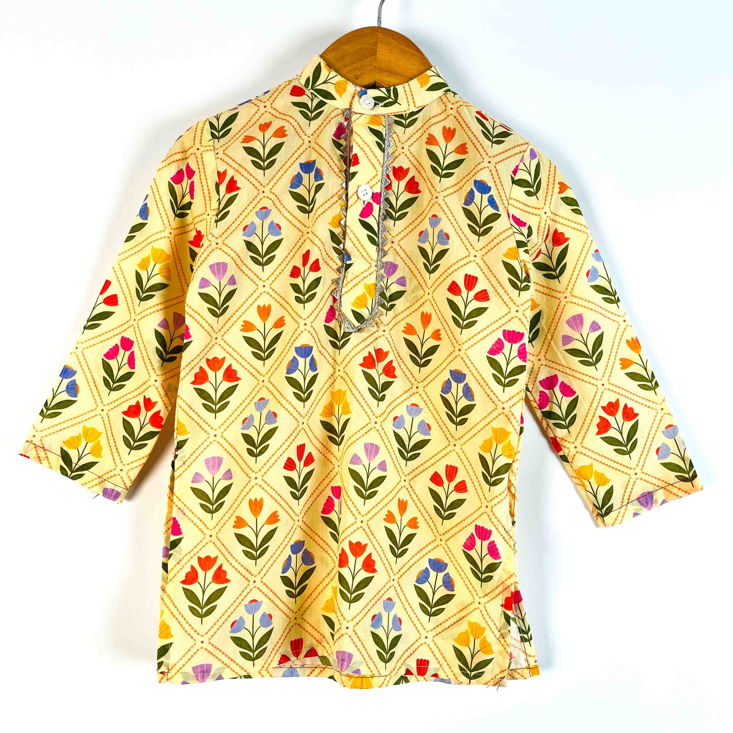 Front view of boys Yellow Petals printed cotton kurta with full sleeves and mandarin collar