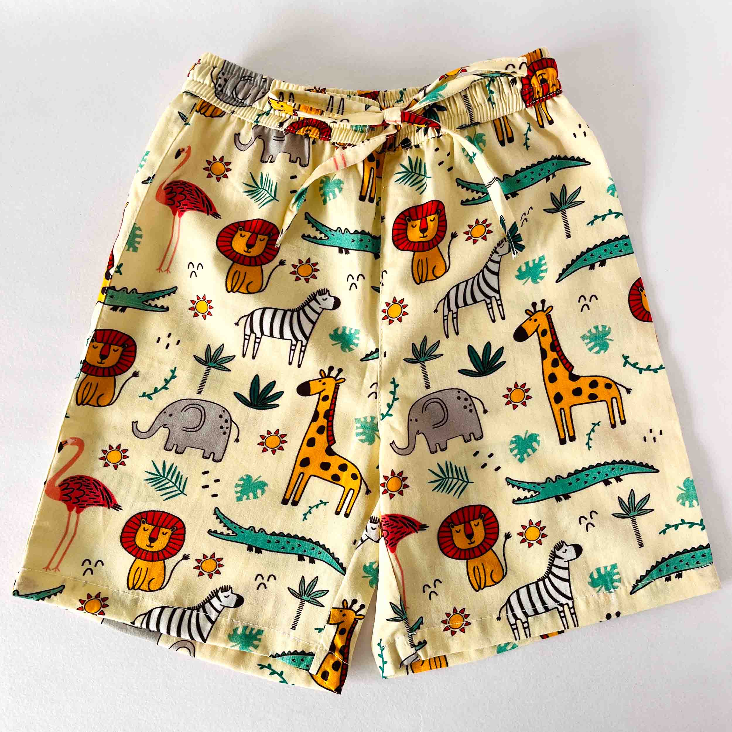 Children's shorts with animal pattern on a white background