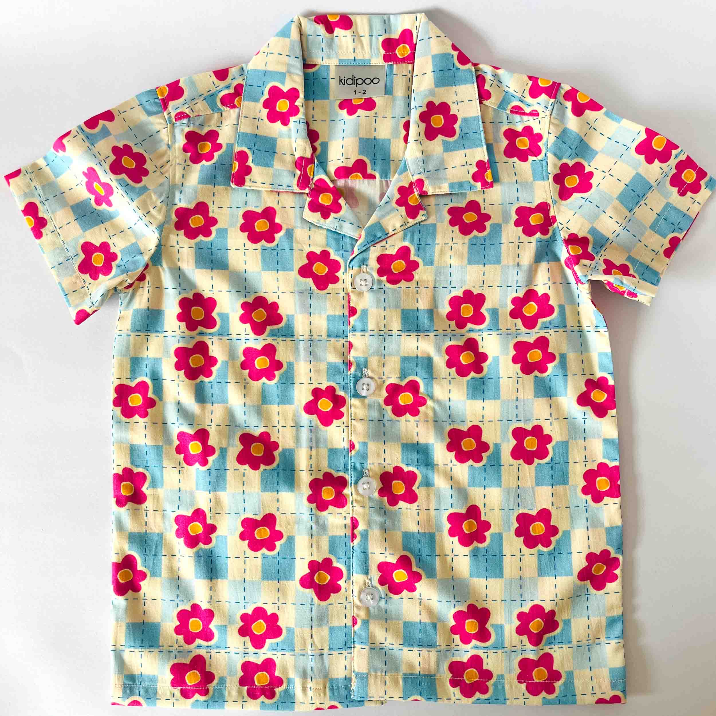 Children's shirt with floral pattern on a white background