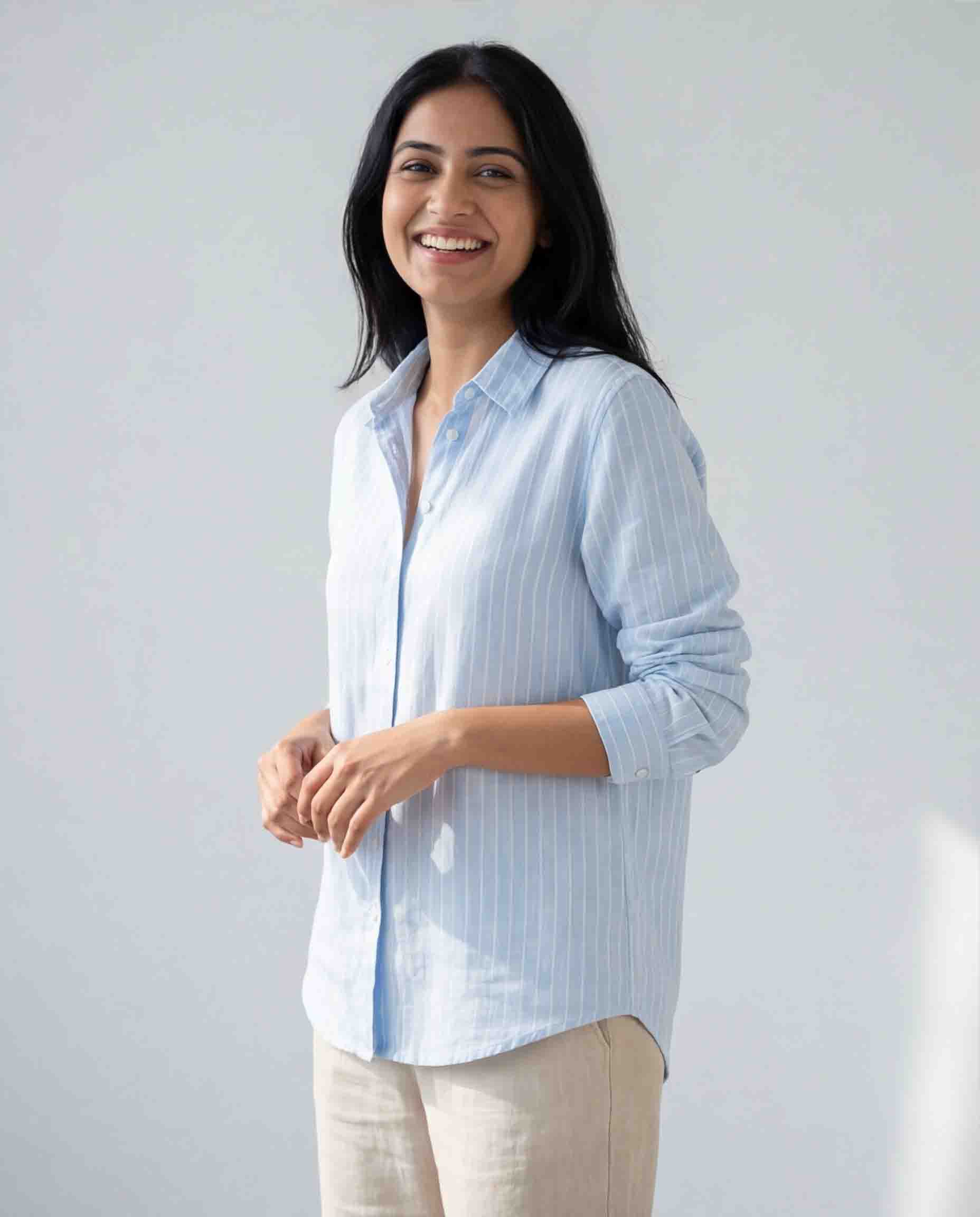 Light blue striped women's shirt side view casual office wear