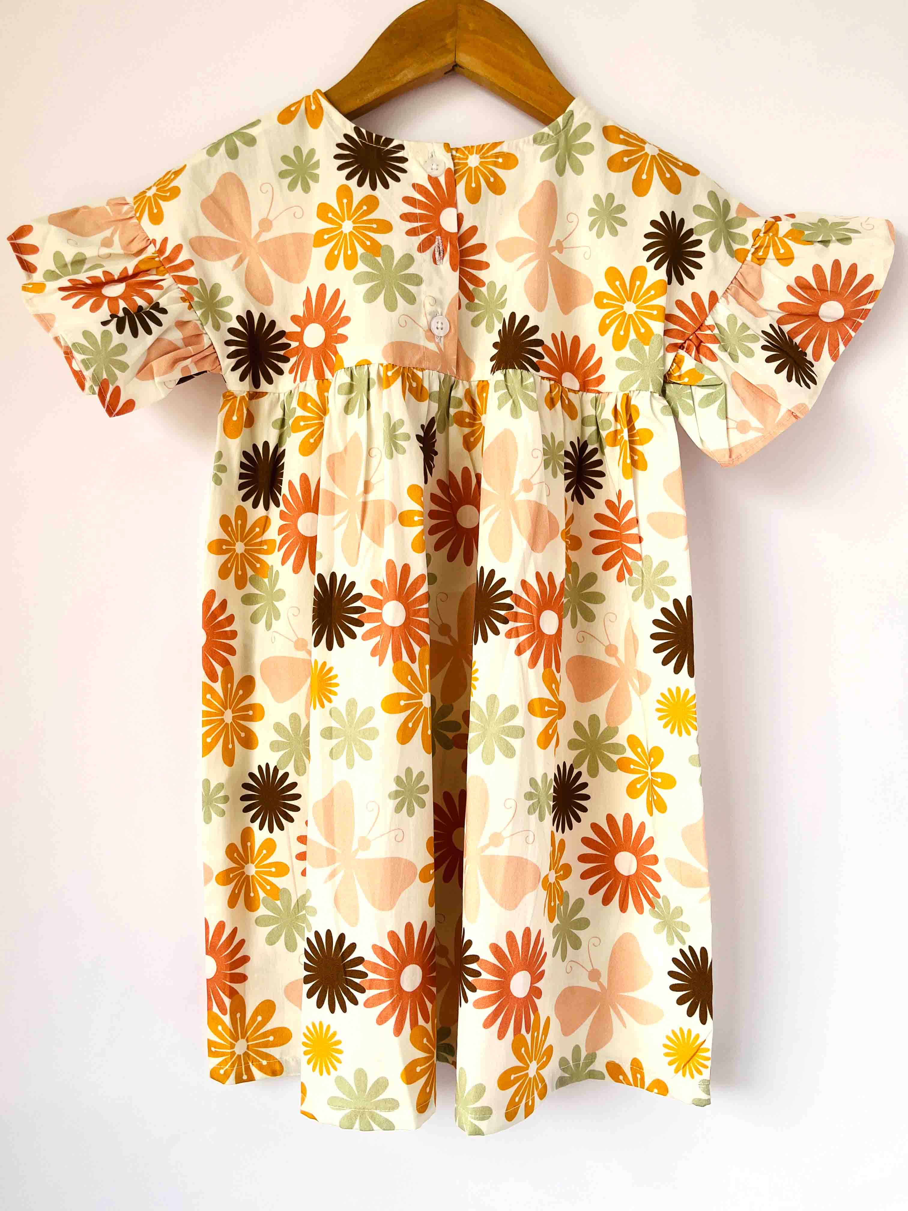 Kids cotton dress with multicolor floral print back view with pleated design