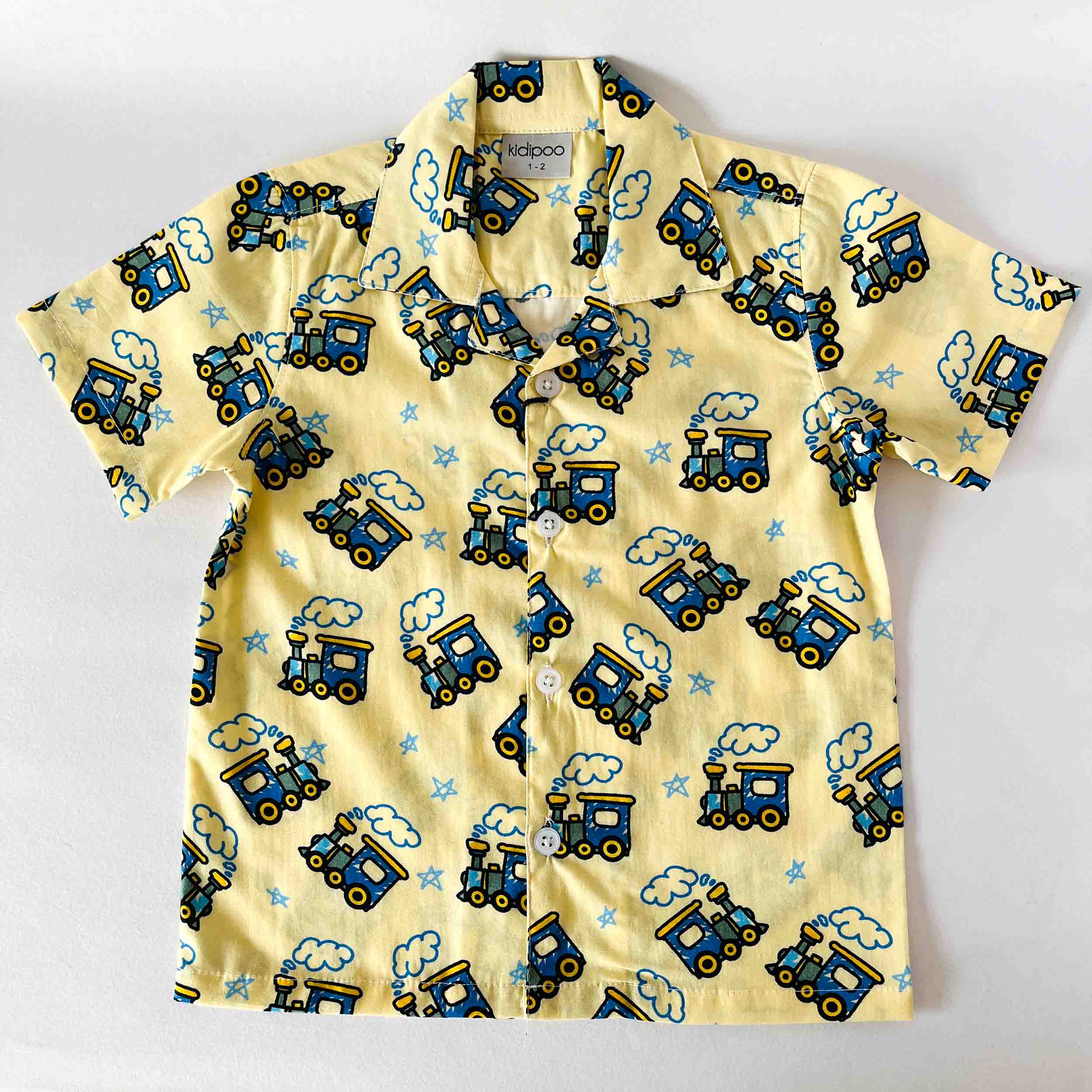 Children's shirt with train pattern on a white background