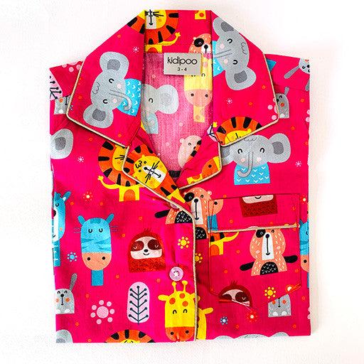 Kids pink circus animals cotton night suit shirt with elephant tiger giraffe print, soft breathable button-down sleepwear top for boys and girls.
