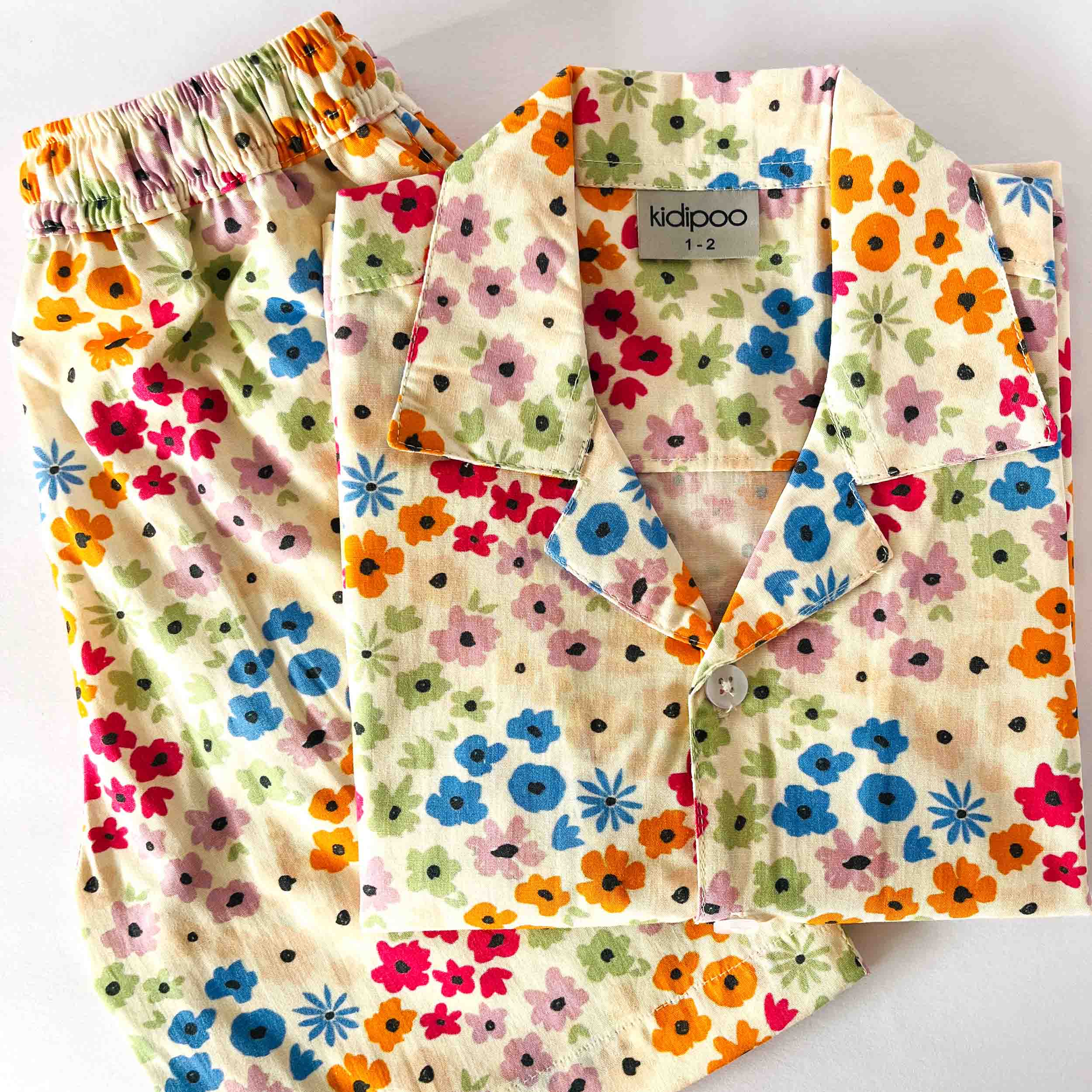 Kids colorful floral print cotton co-ord set with half sleeve front button shirt and matching shorts