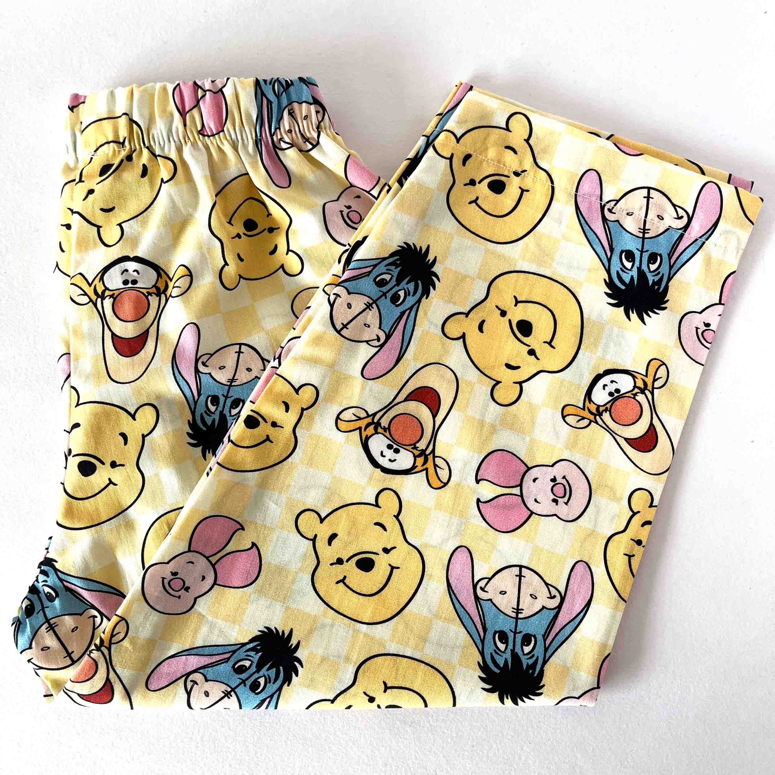 Pair of shorts with cartoon character pattern on a white background