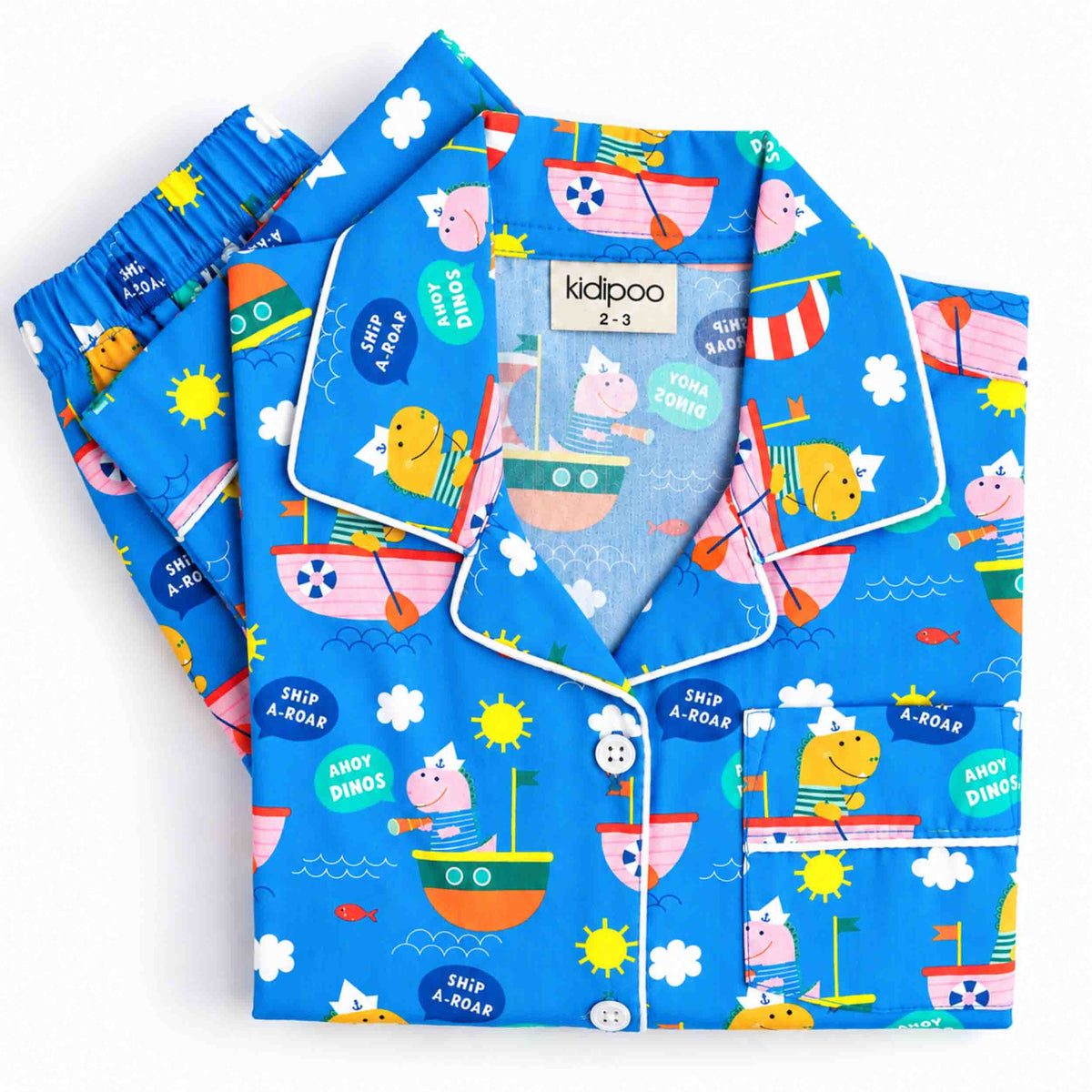 Dino Sailors kids night suit in bright blue with playful dinosaur, sailor ship, fish, cloud and sun prints, featuring a long-sleeve button-front shirt and matching pajama