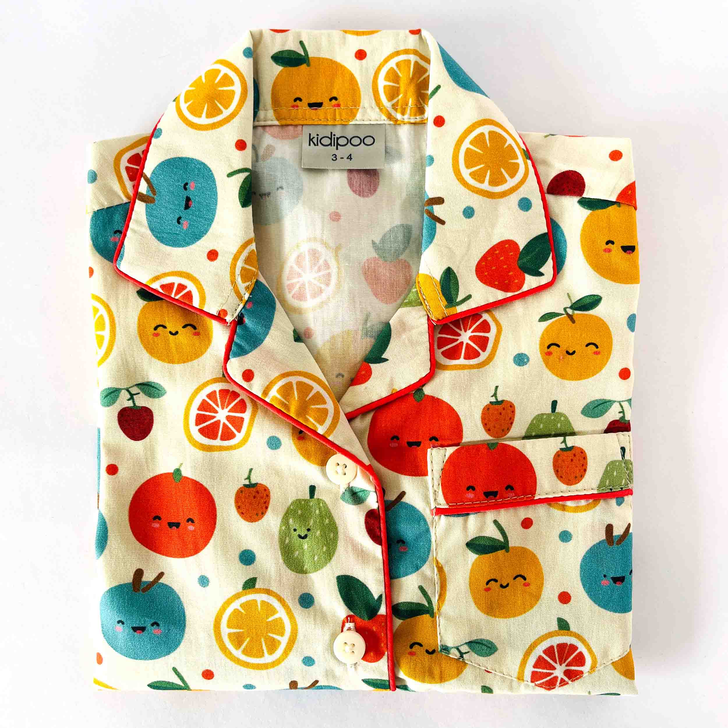 Children's pajama set with fruit pattern on a white background