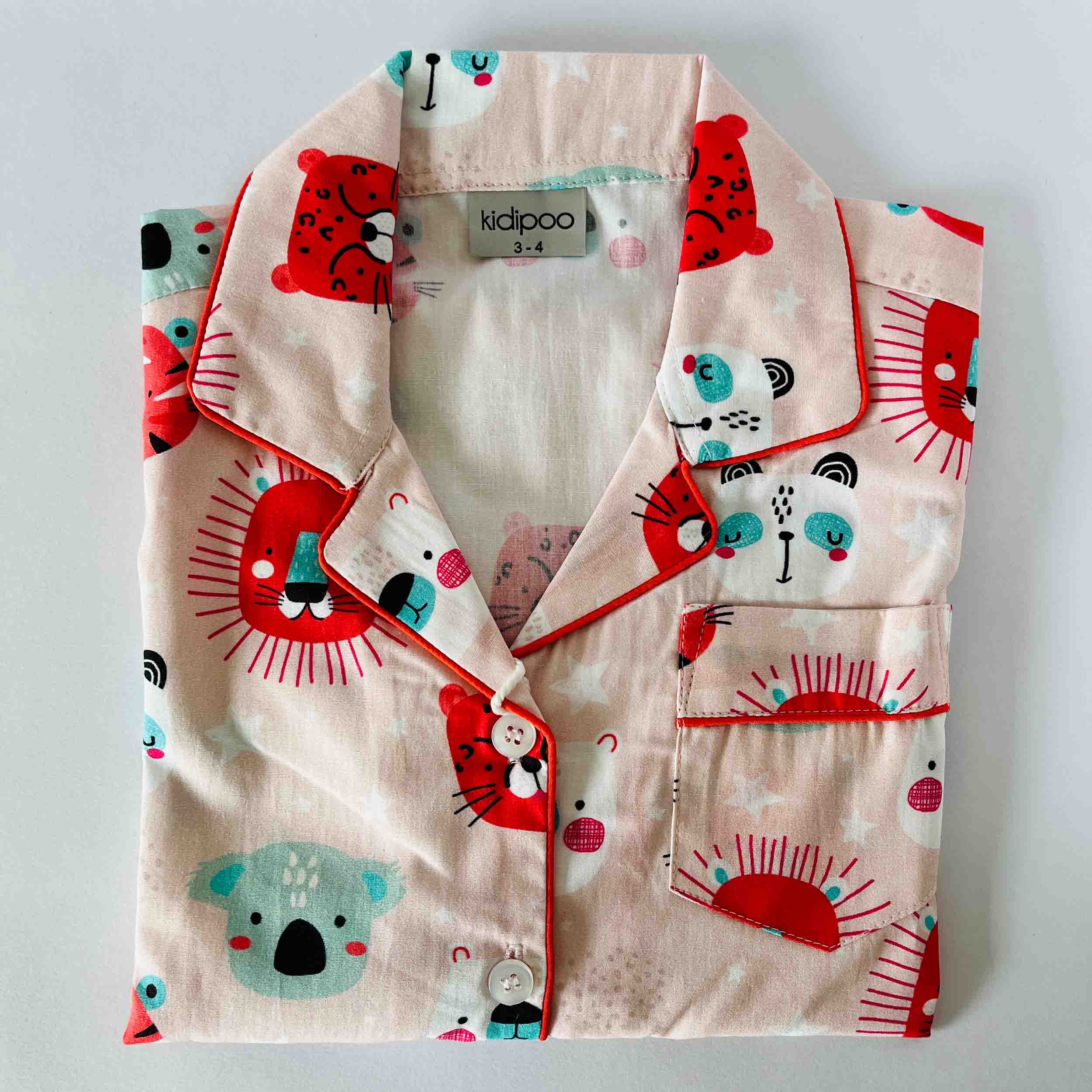 Folded shirt with panda pattern on a light gray background