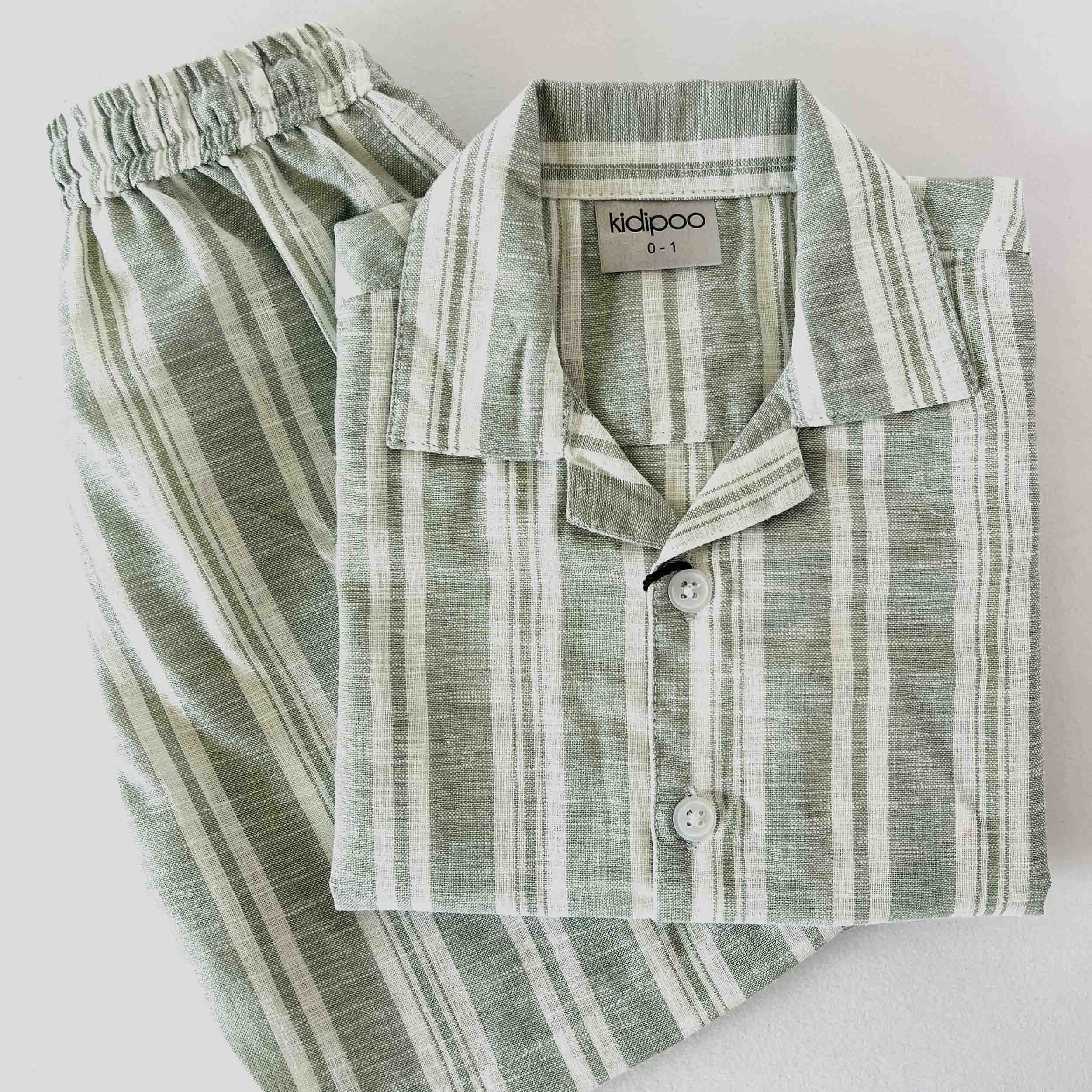 Green and white striped shirt and pants set with 'kidipoo' label on a light background