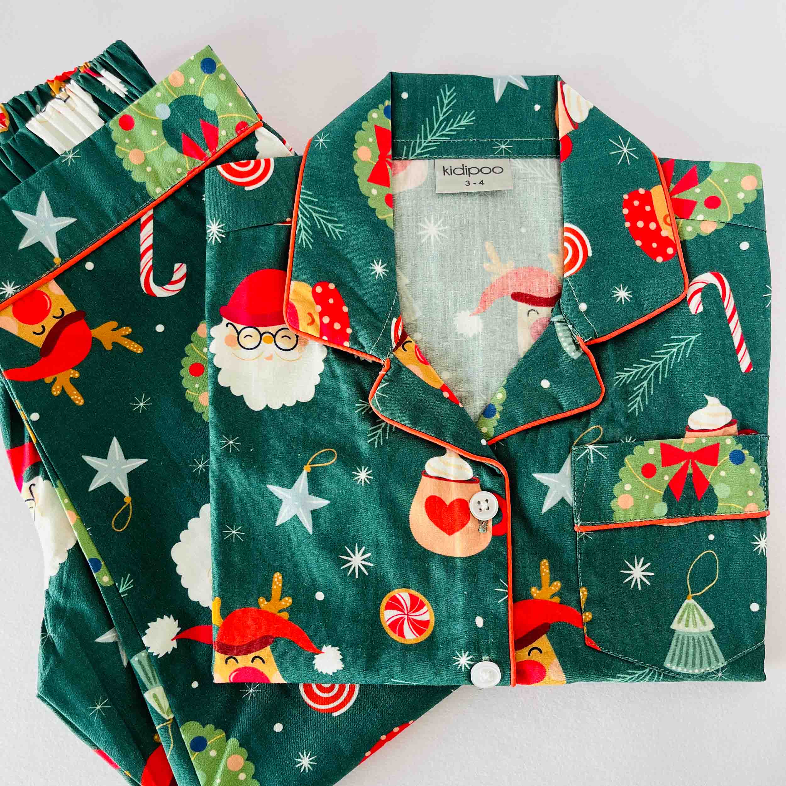 Green Santa print kids cotton night suit set with long sleeve shirt and matching pajama