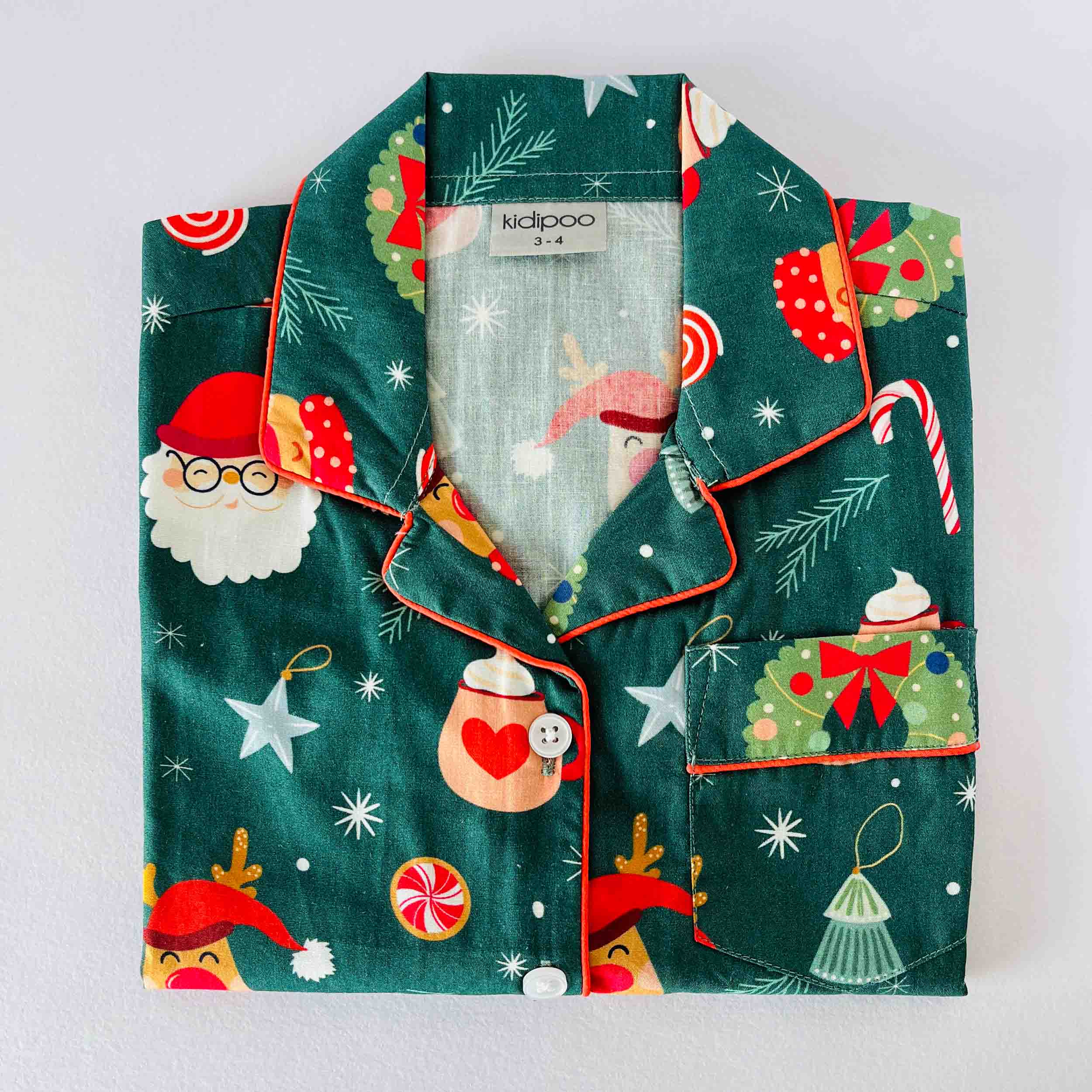 Green Santa print kids cotton night suit long sleeve shirt with Christmas theme design