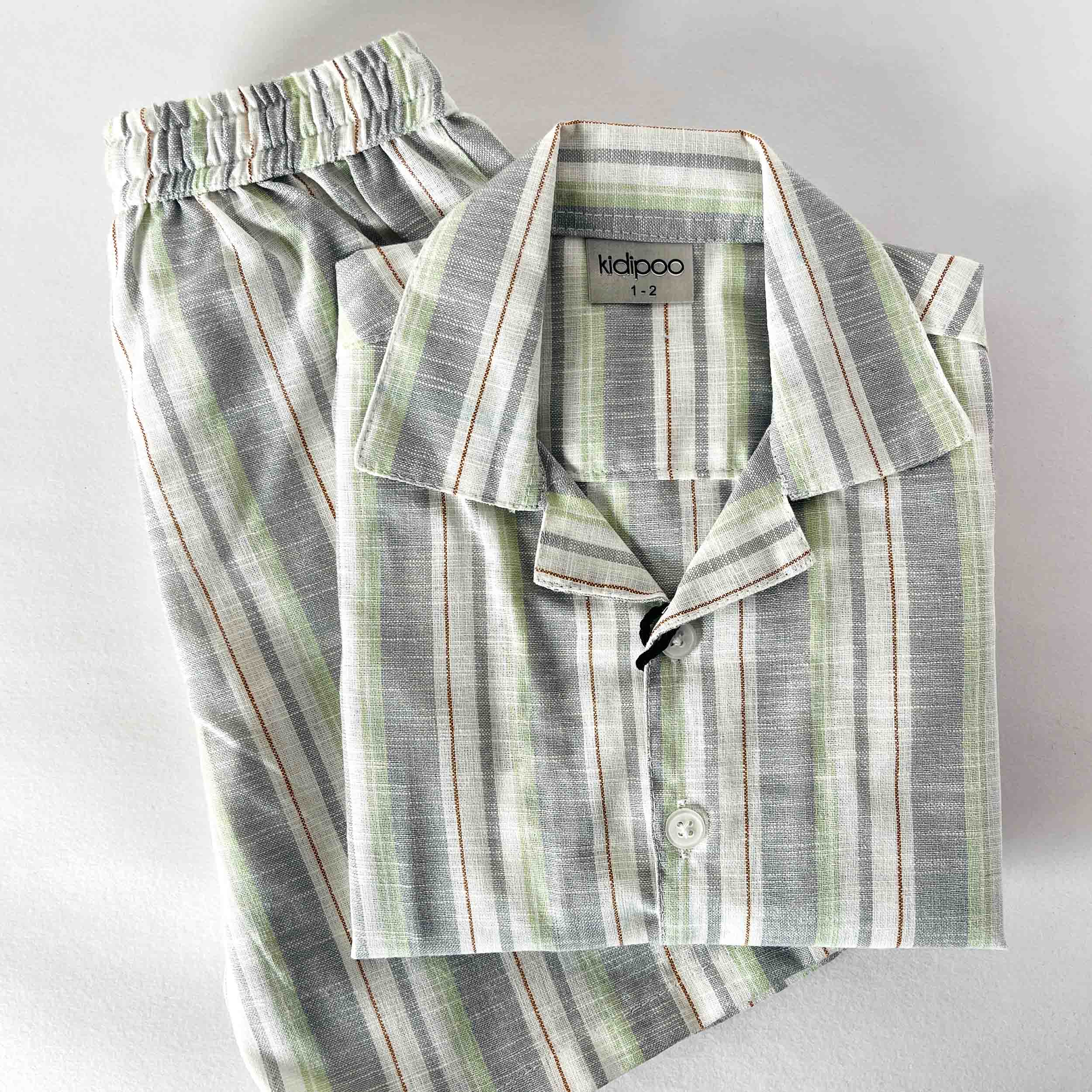 Kids striped co-ord set featuring a collared button-down shirt and matching shorts in grey and green stripes, displayed on a light background
