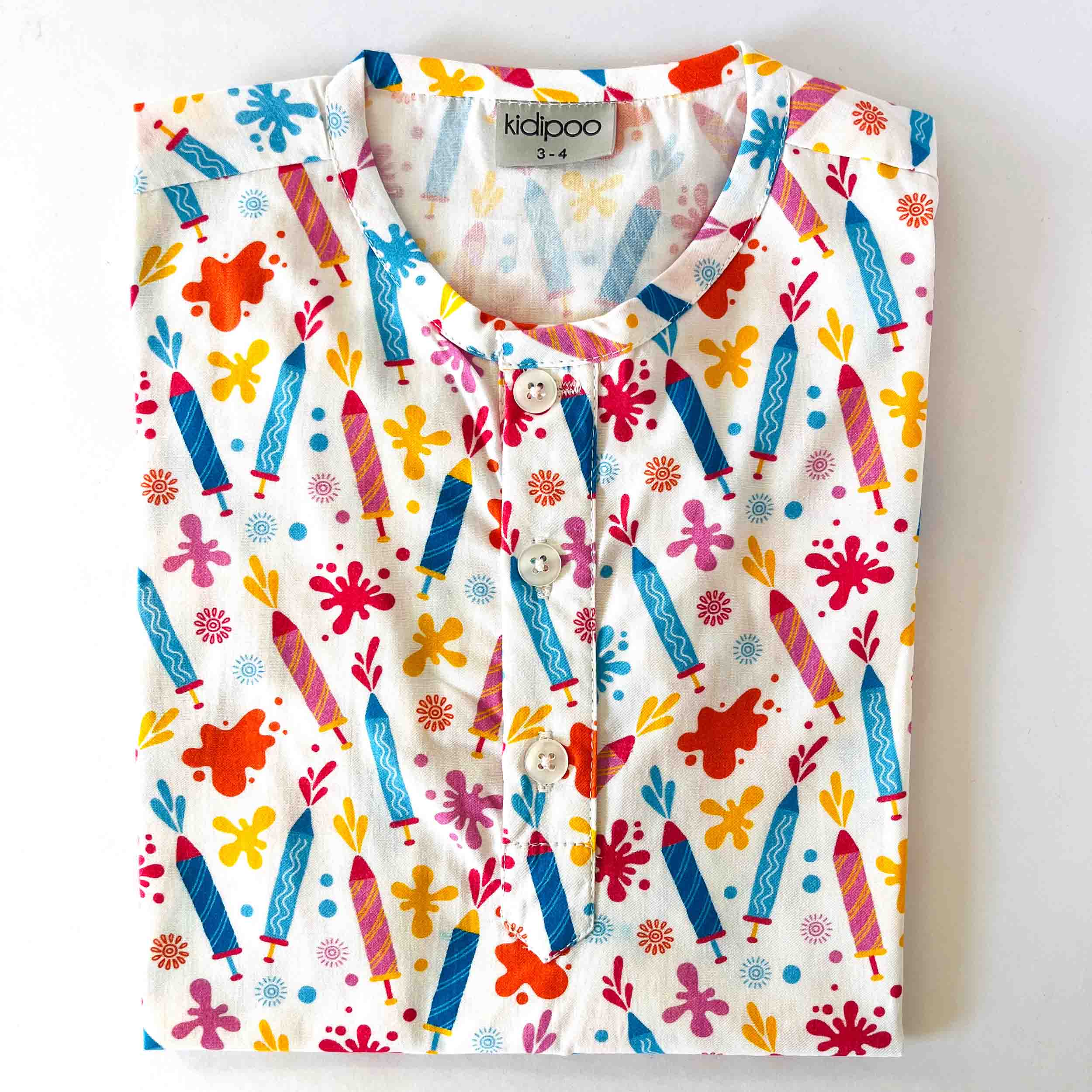 Children's shirt with colorful crayon pattern on a white background