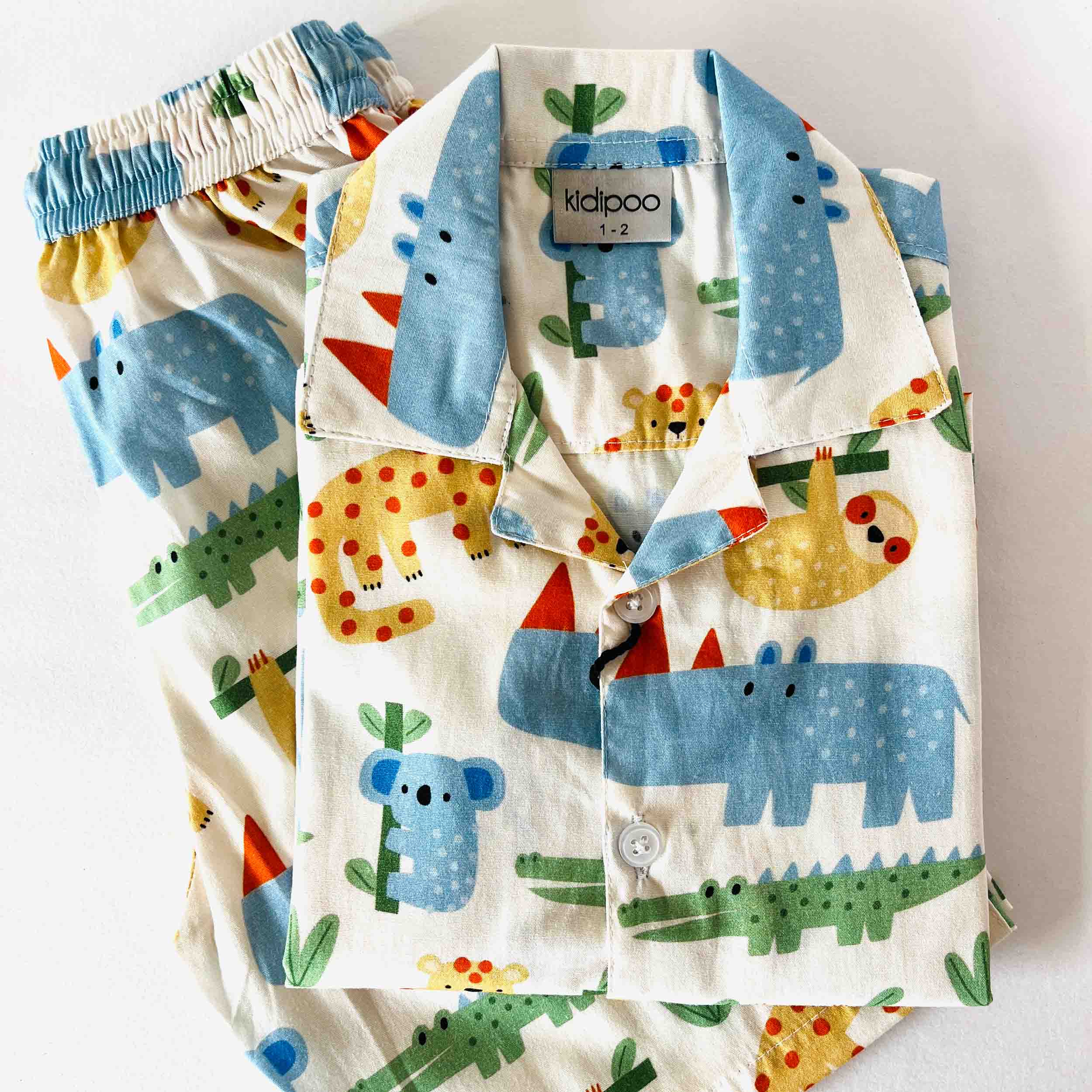 Children's pajama set with animal pattern on a white background