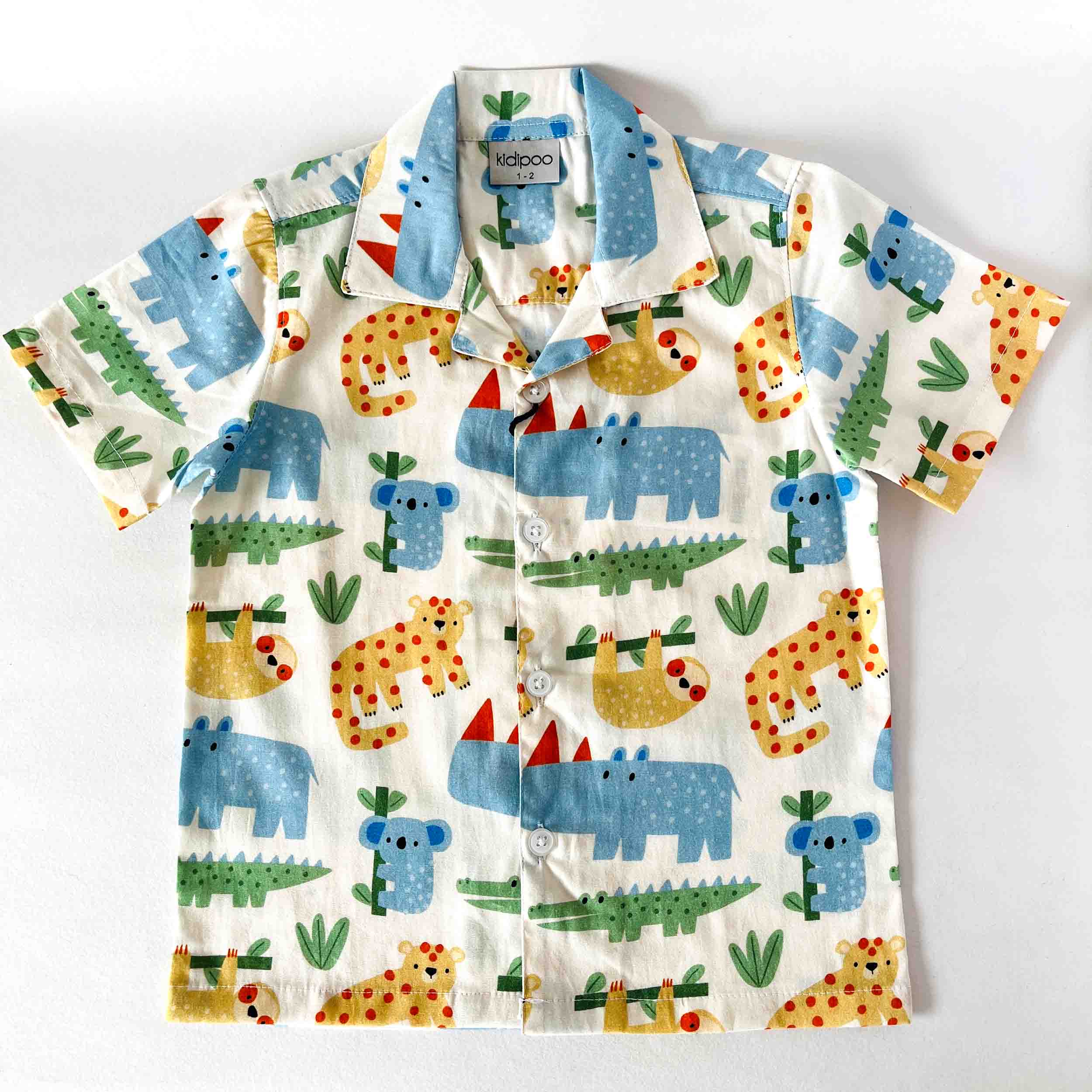 Children's shirt with animal pattern on a white background
