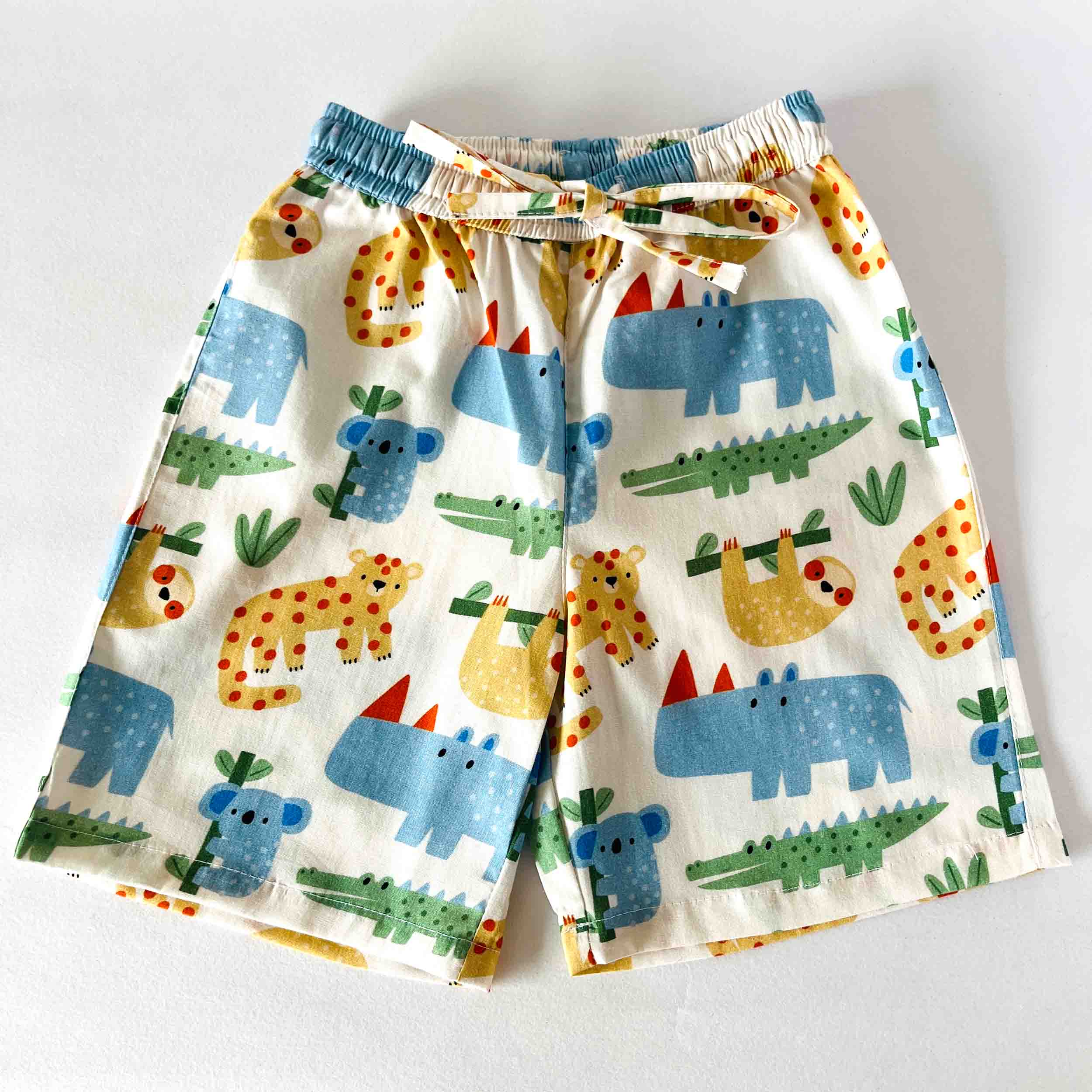 Children's shorts with animal pattern on a white background