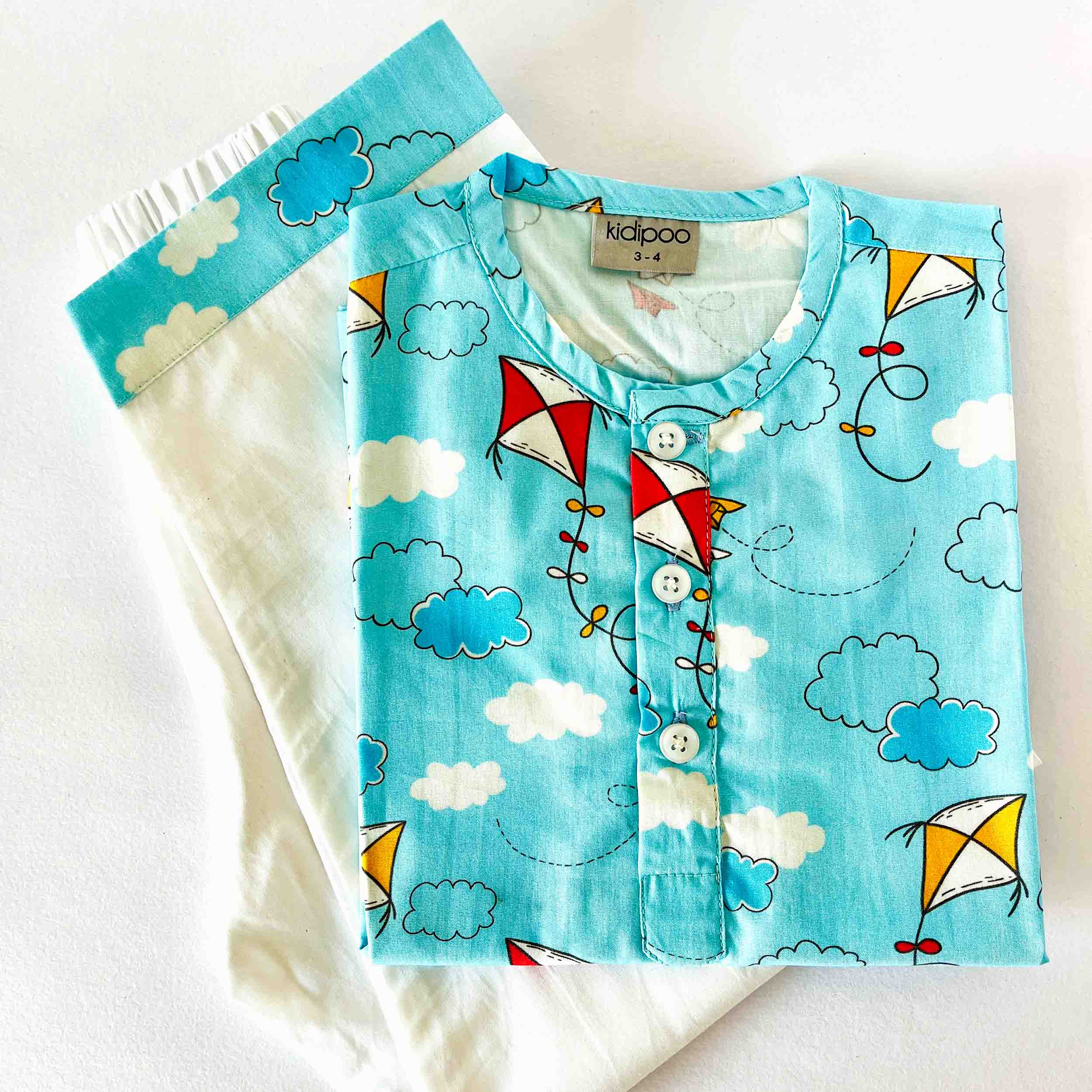 Children's shirt with kite pattern on a white background