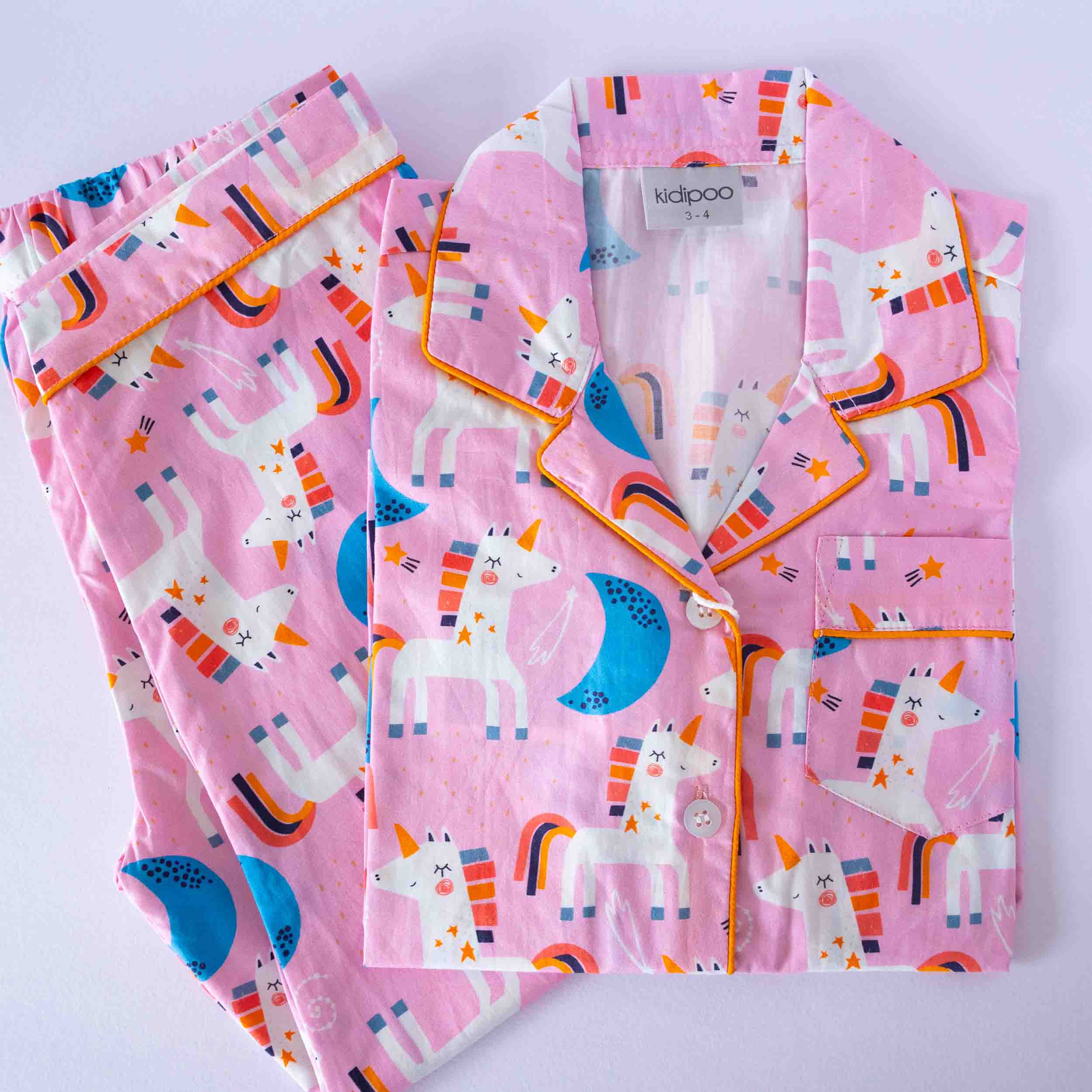 Pink unicorn print kids night suit soft cotton sleepwear set folded view