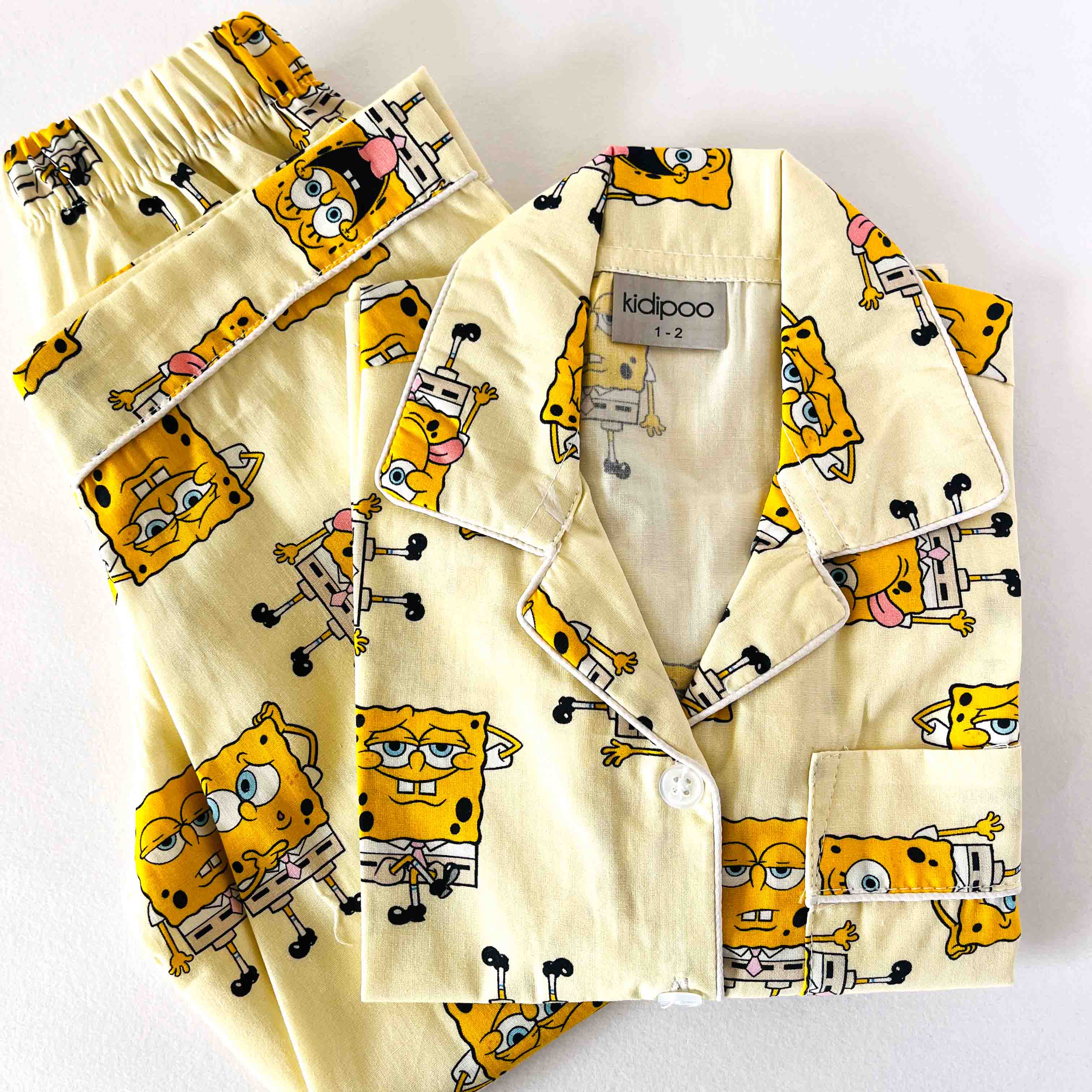 Children's pajama set with cartoon character pattern on a white background