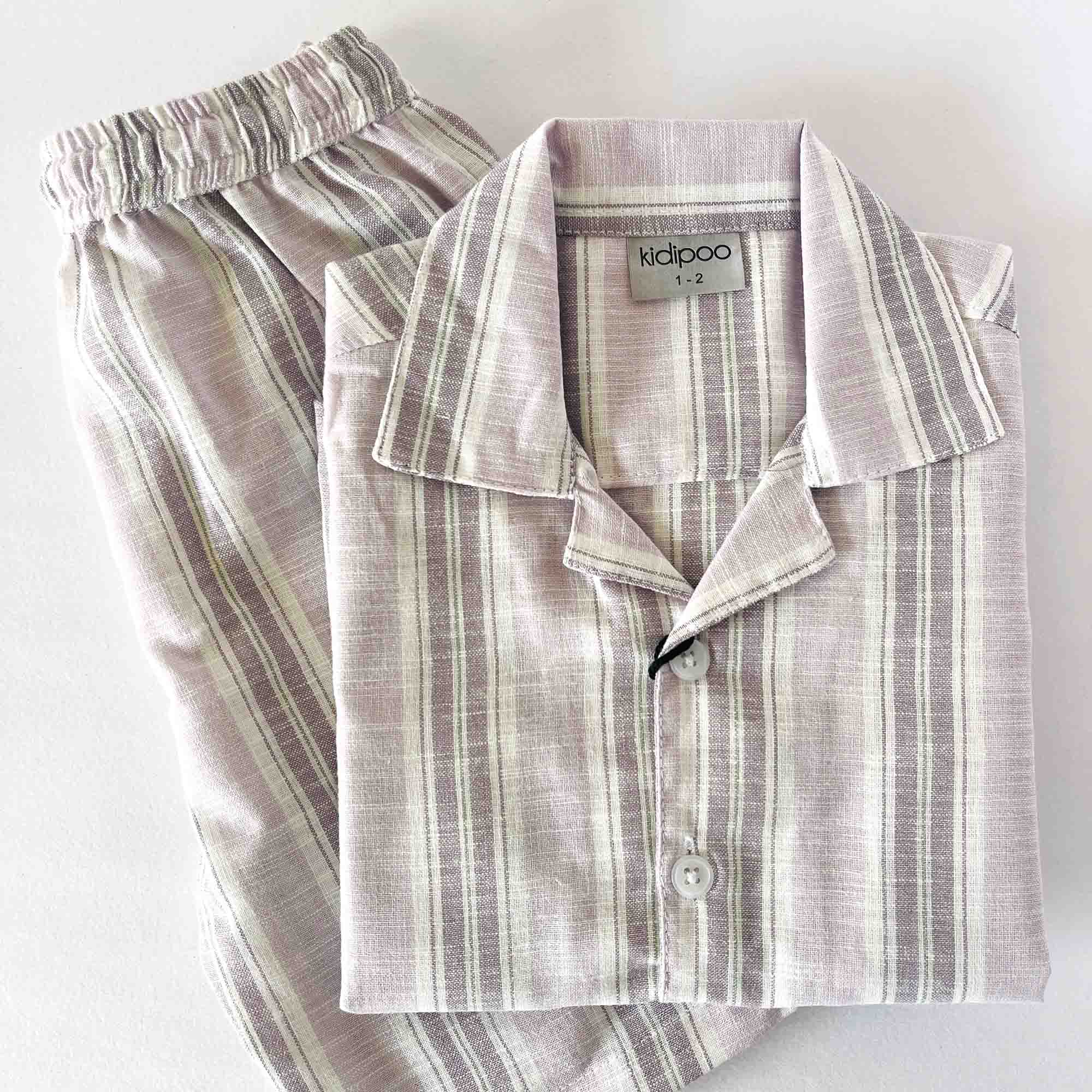 Striped pajama set with 'kidipoo' label on a white background