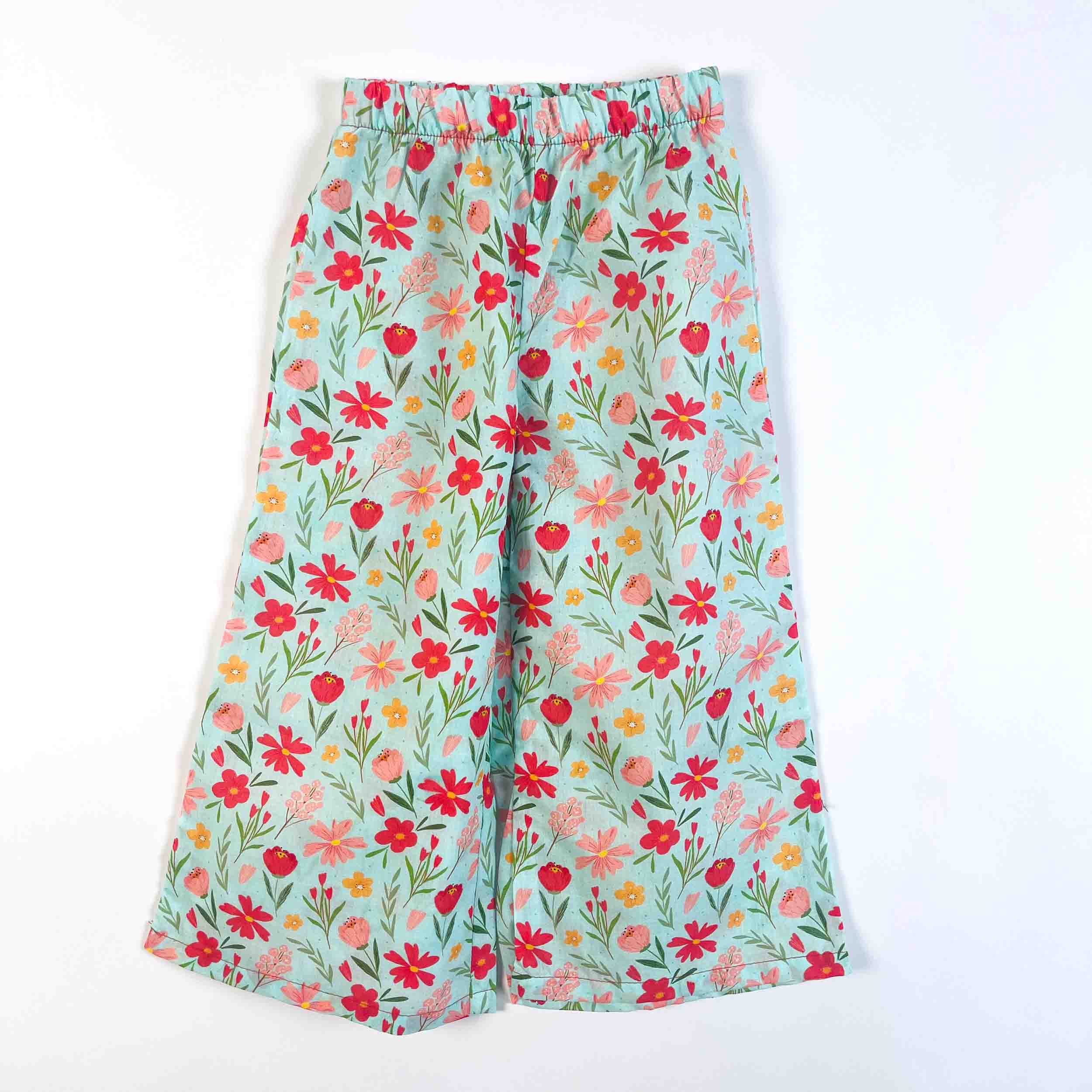 Girls' mint floral wide-leg palazzo pants with an elastic waistband, made from 100% premium cotton.
