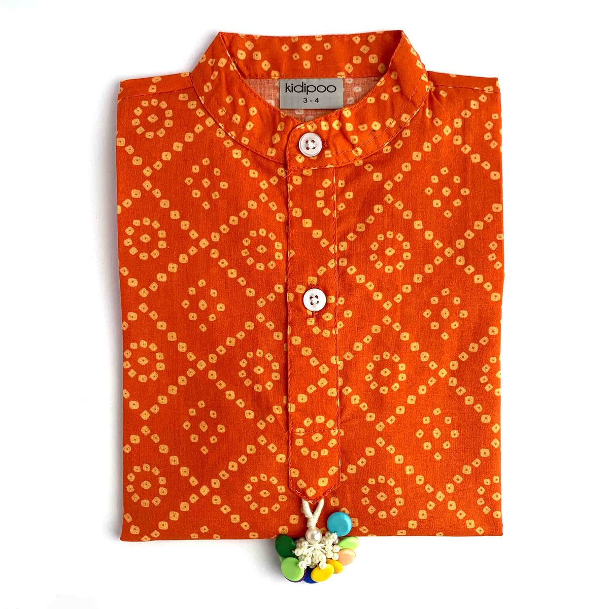 Kids orange Badhni kurta with traditional geometric print and cream pajama