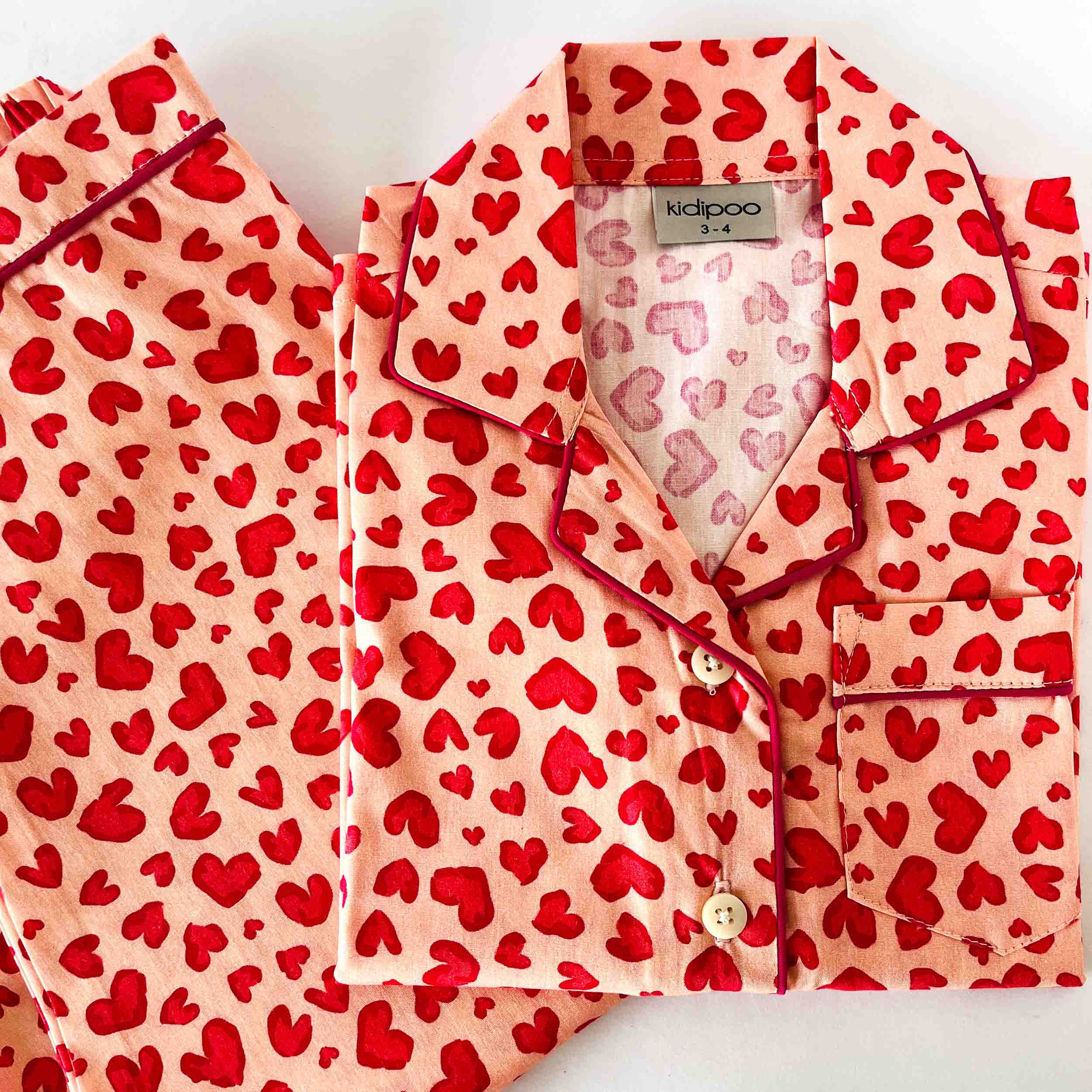 Kids pink hearts print cotton night suit with long sleeve button-down shirt and pajama set