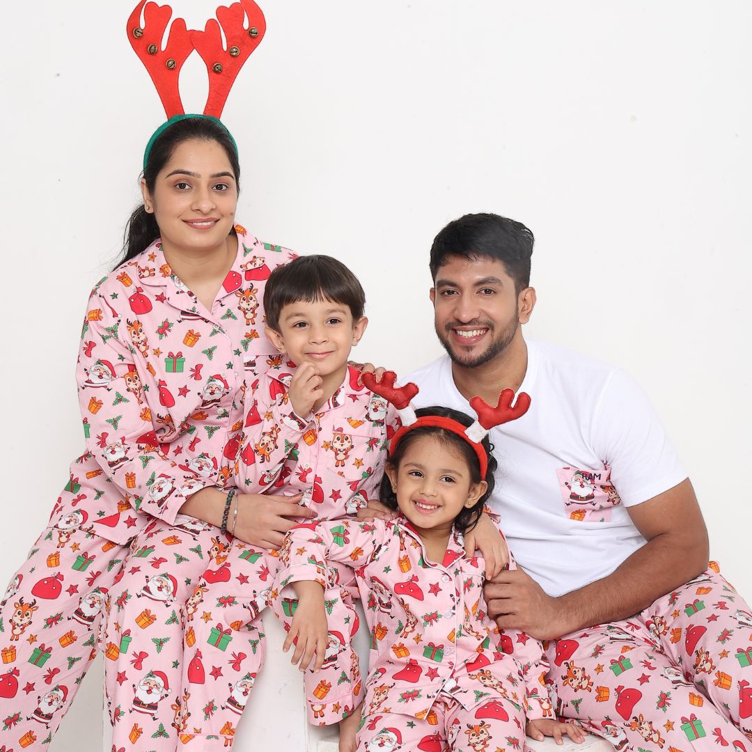 Family wearing matching pink Santa print cotton night suits festive sleepwear set