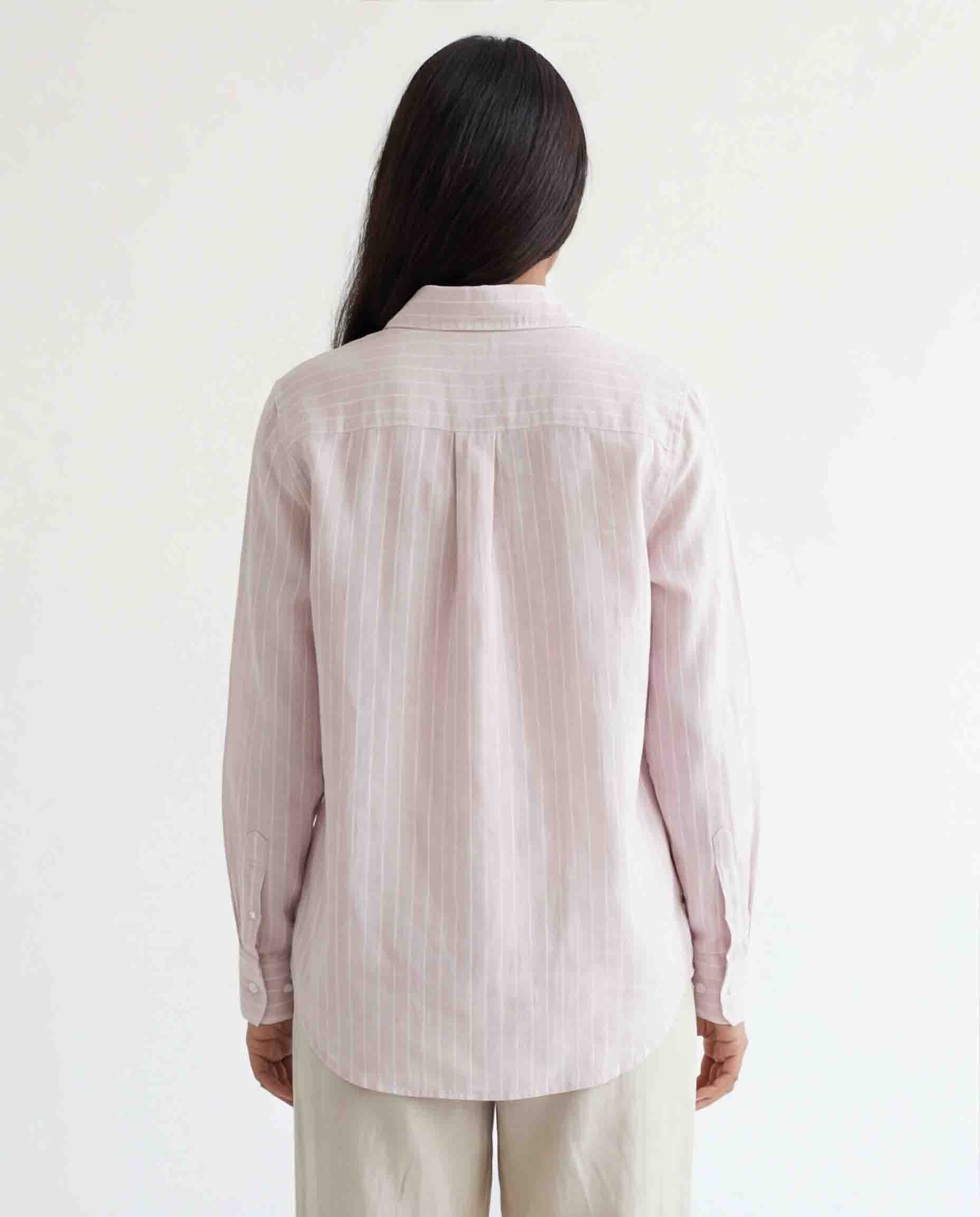 Back view of women's light pink striped shirt long sleeves cotton wear