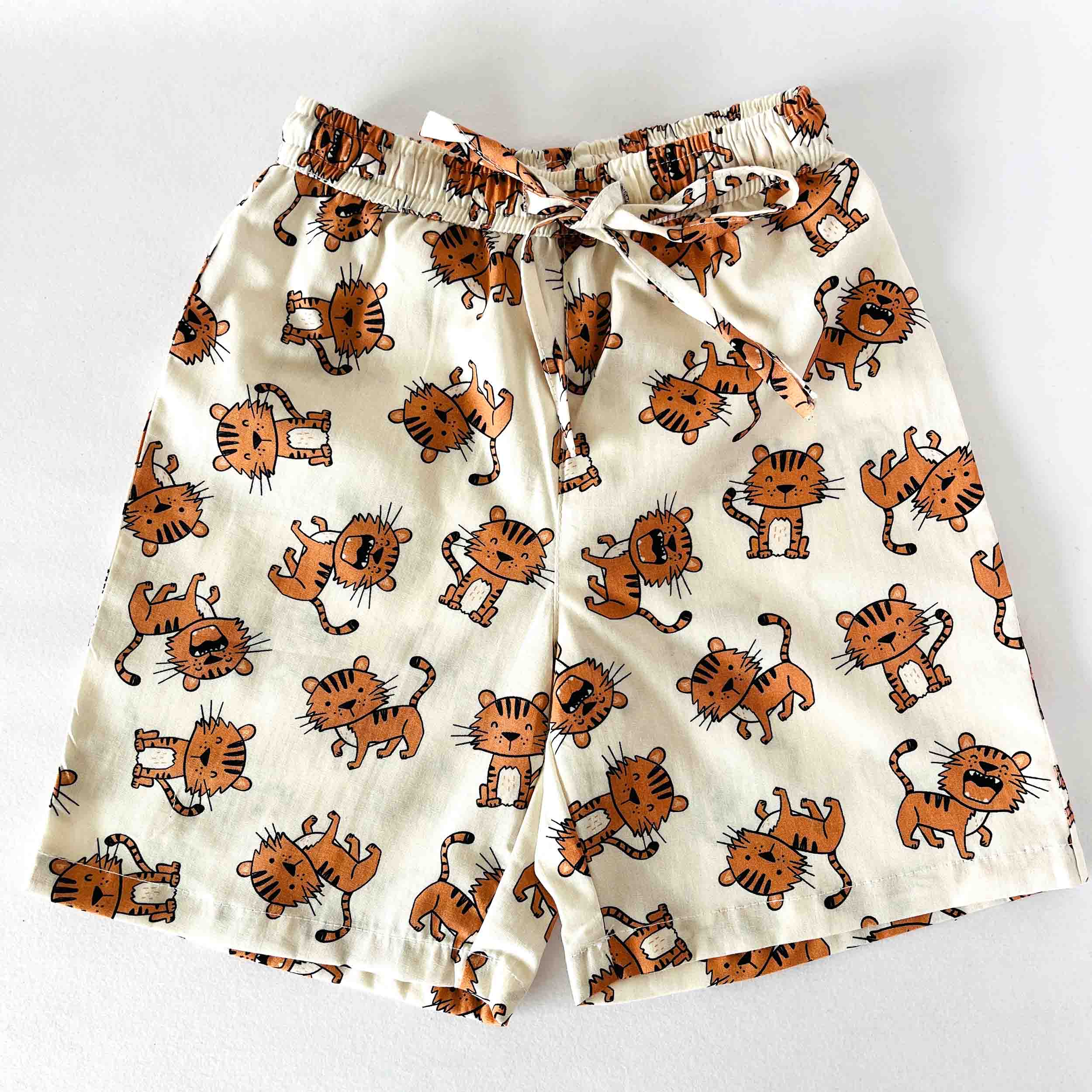 Pajama shorts with tiger pattern on a white background