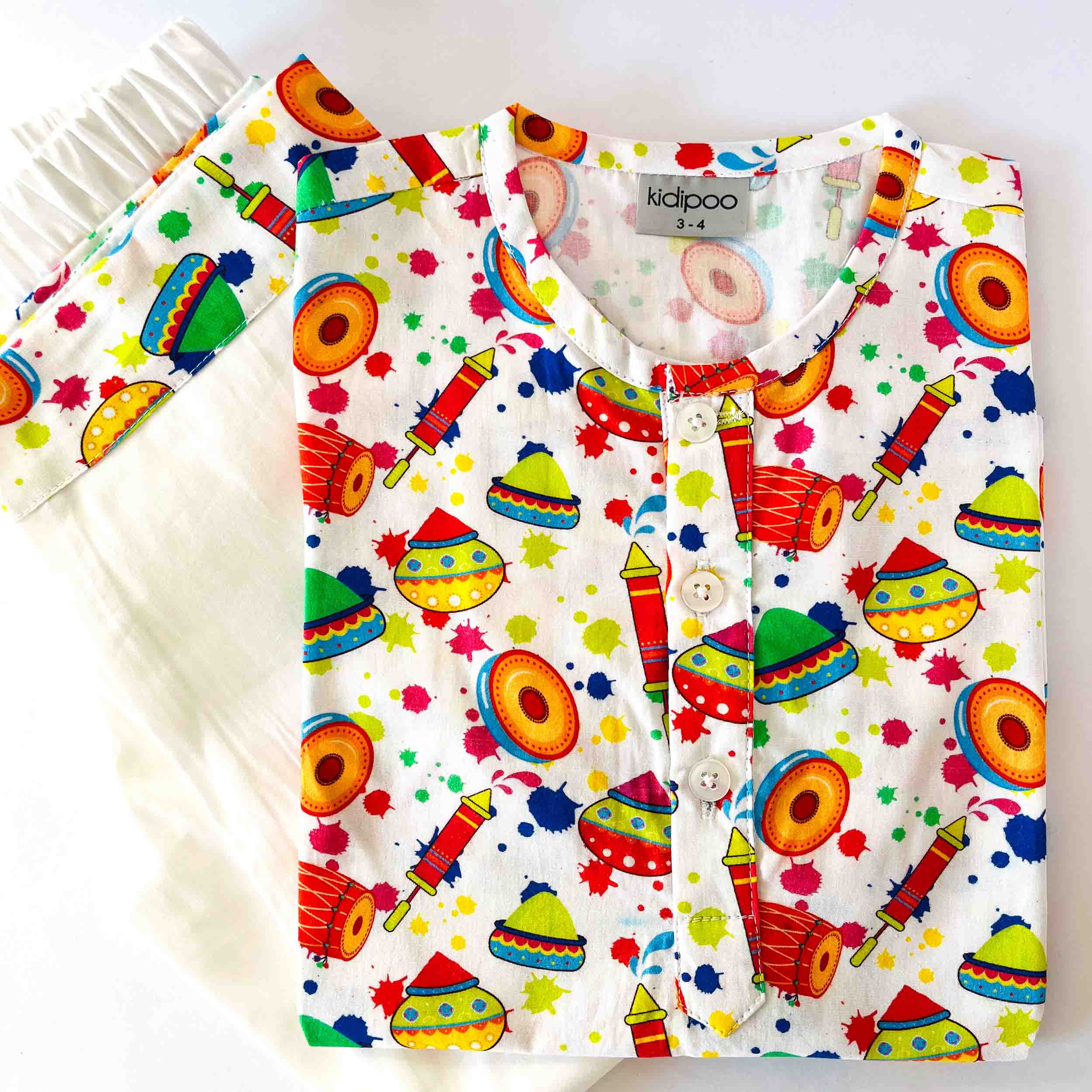 Colorful children's pajama set with festive patterns on a white background
